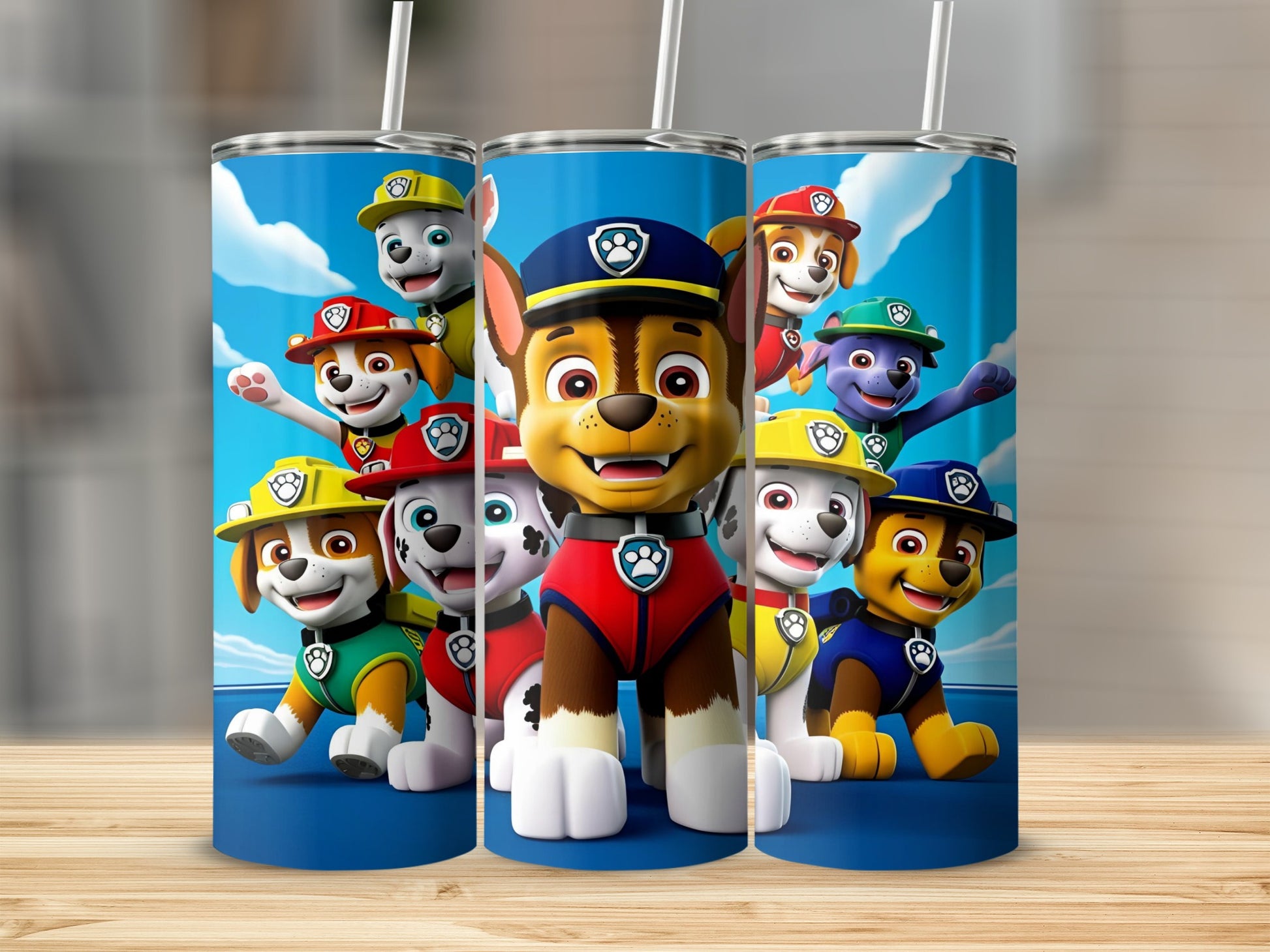 Paw Patrol characters Chase, Marshall, Rubble, Skye, and Zuma on a blue tumbler.