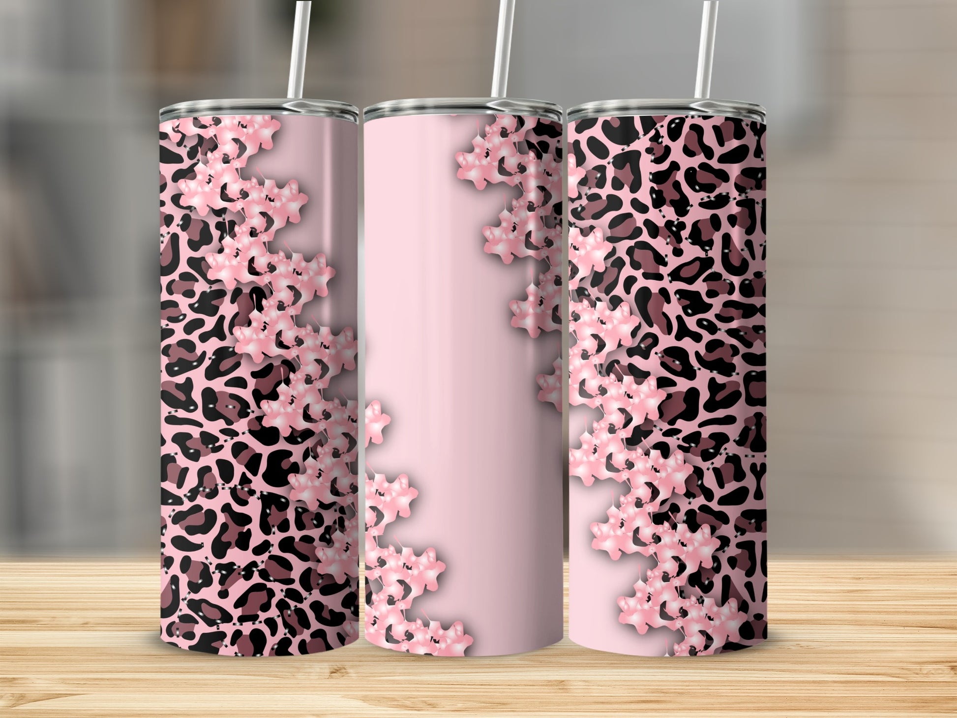 Pink and black leopard print tumbler with delicate floral accents.