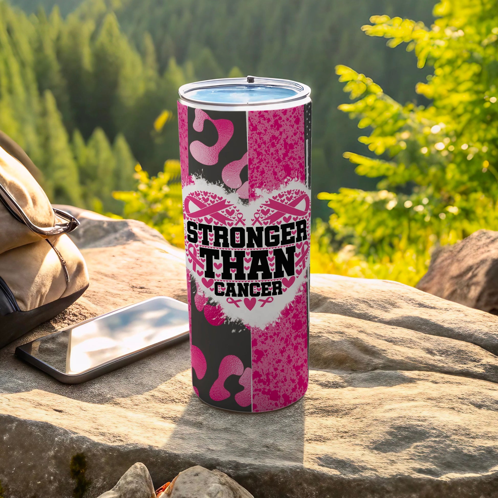 Pink and black abstract design tumbler with "Stronger Than Cancer" text and ribbons.