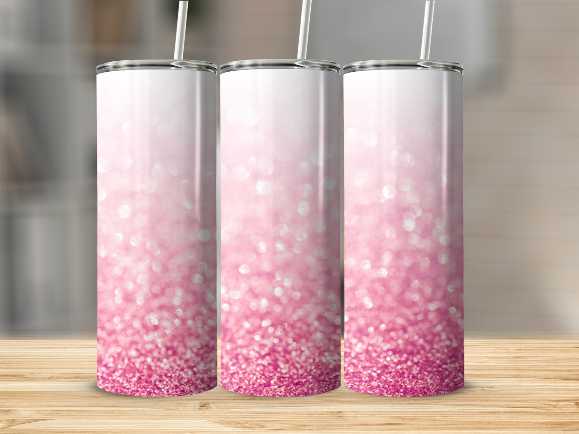 Three tall, skinny tumblers with a pink glitter gradient and white lids.