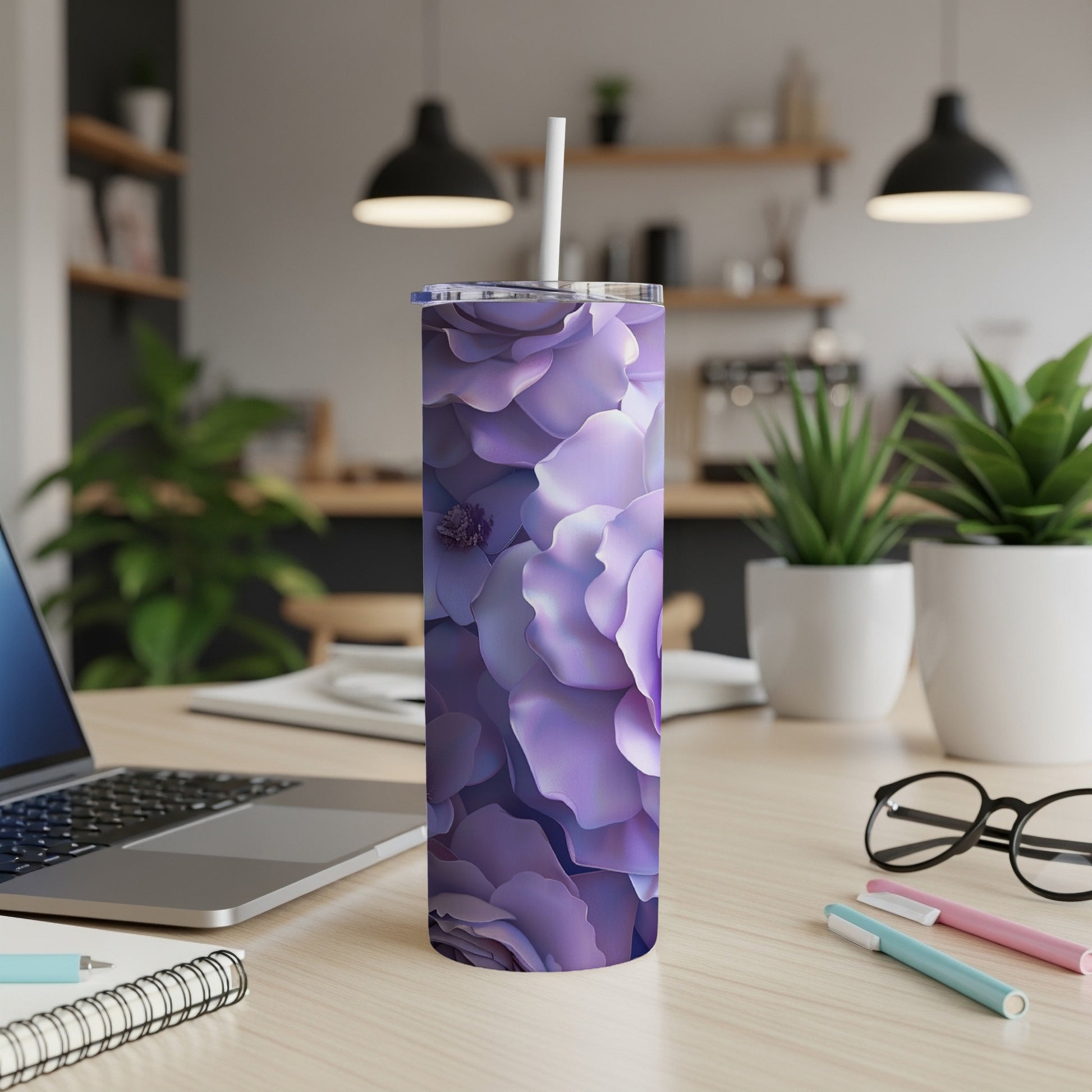 Purple floral pattern on a stainless steel tumbler with a straw.