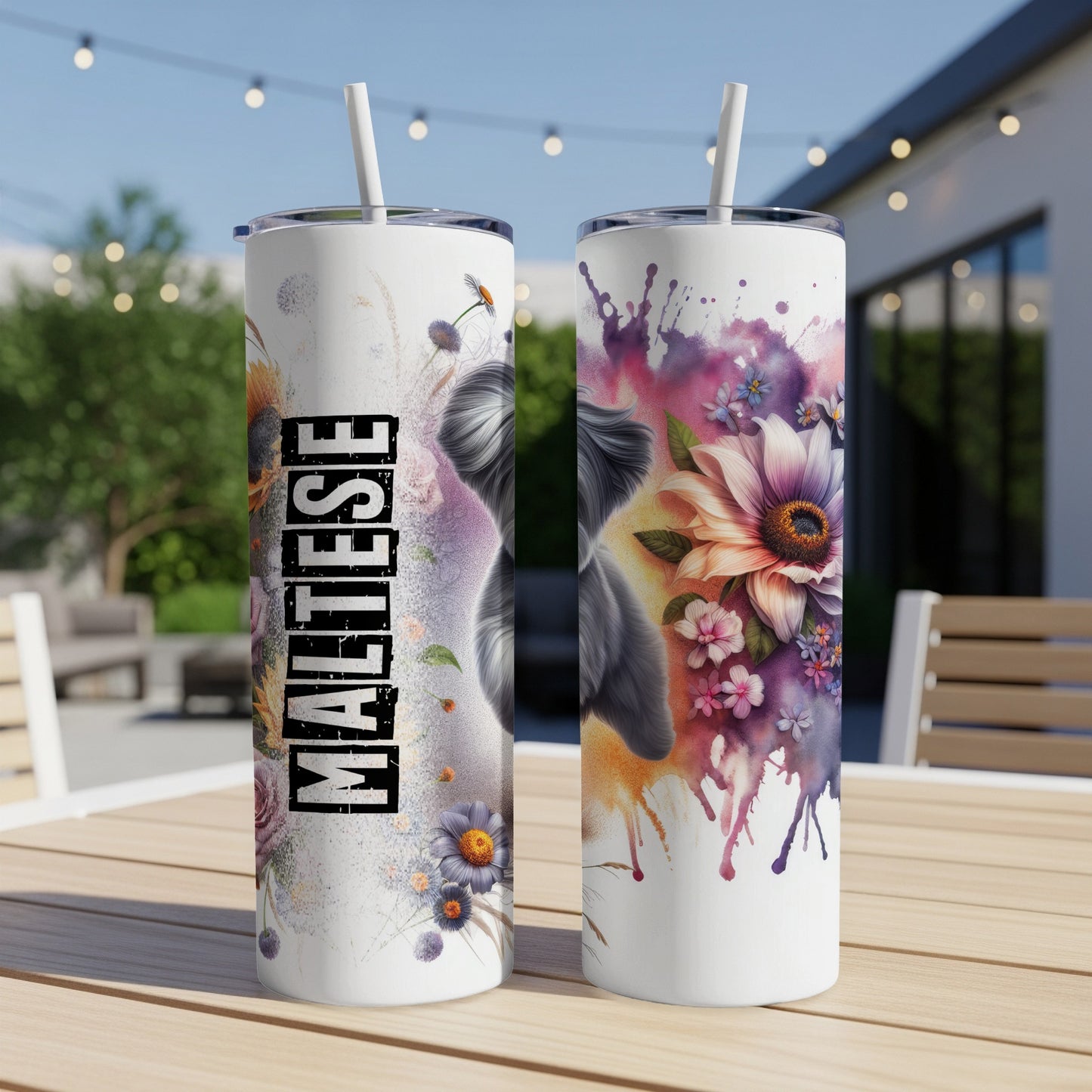 Maltese tumbler with watercolor flowers and artistic text on a table.