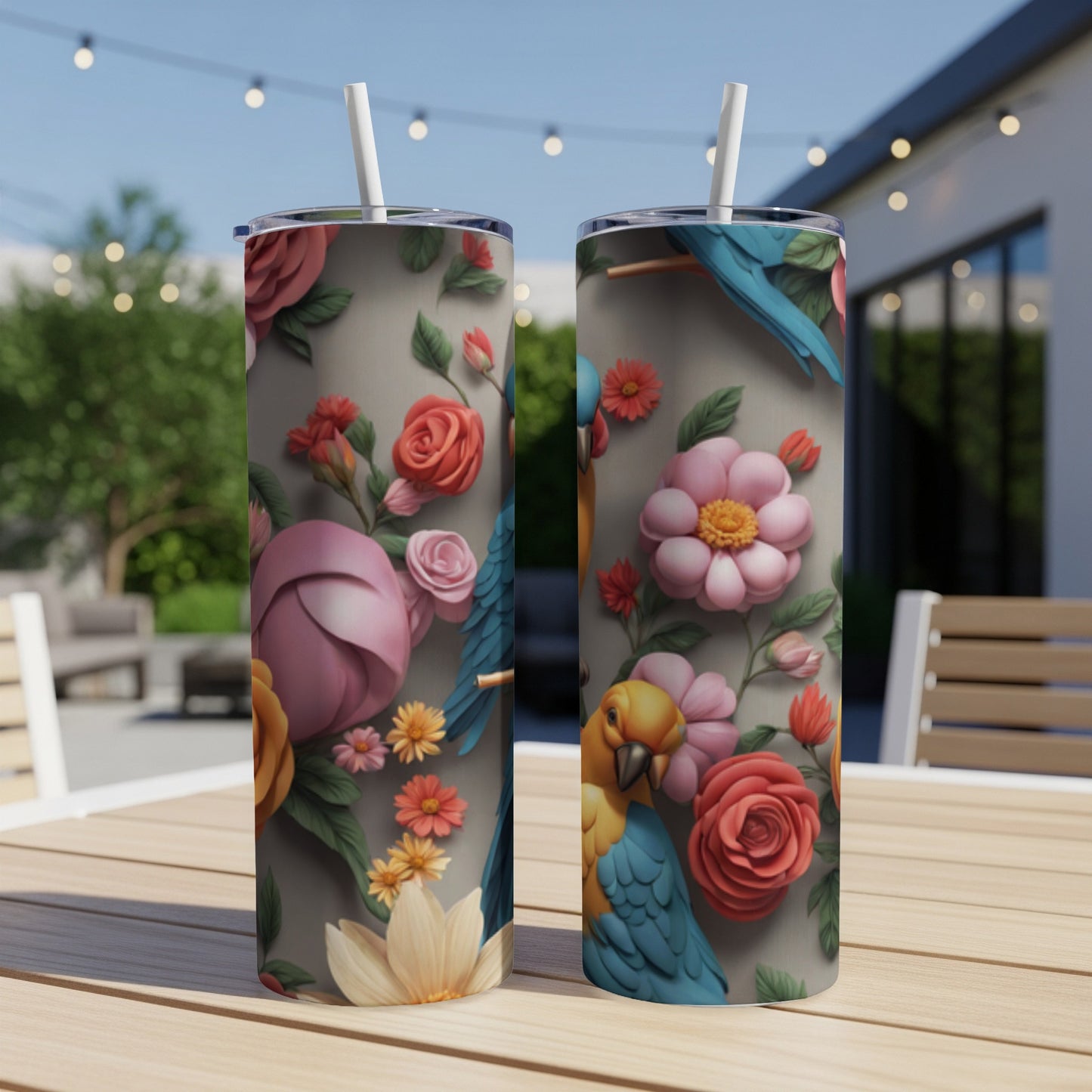 Two parrots and floral design on a pair of tall, narrow tumblers.
