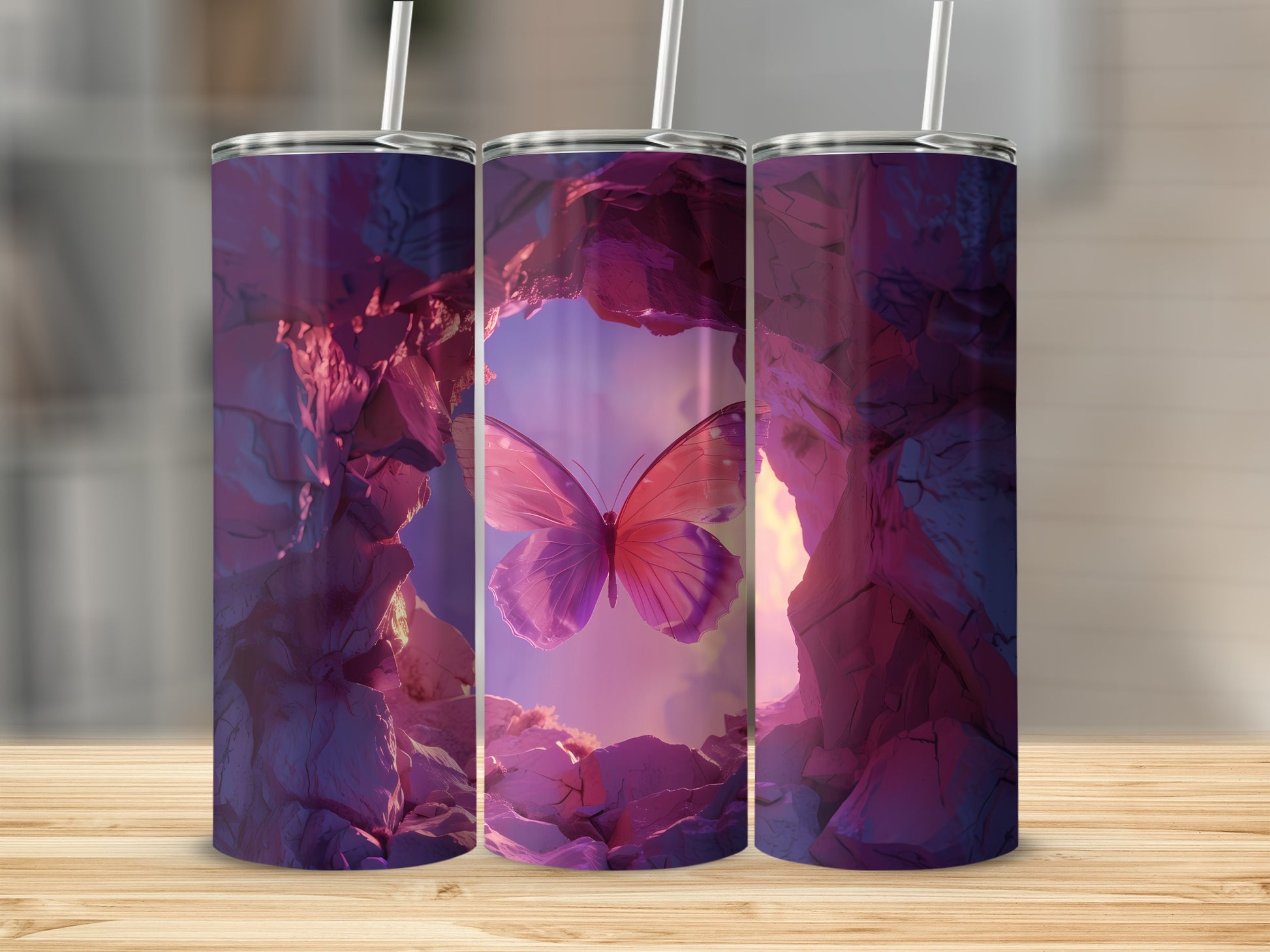 Three tumblers featuring a pink butterfly in a rocky cavern.