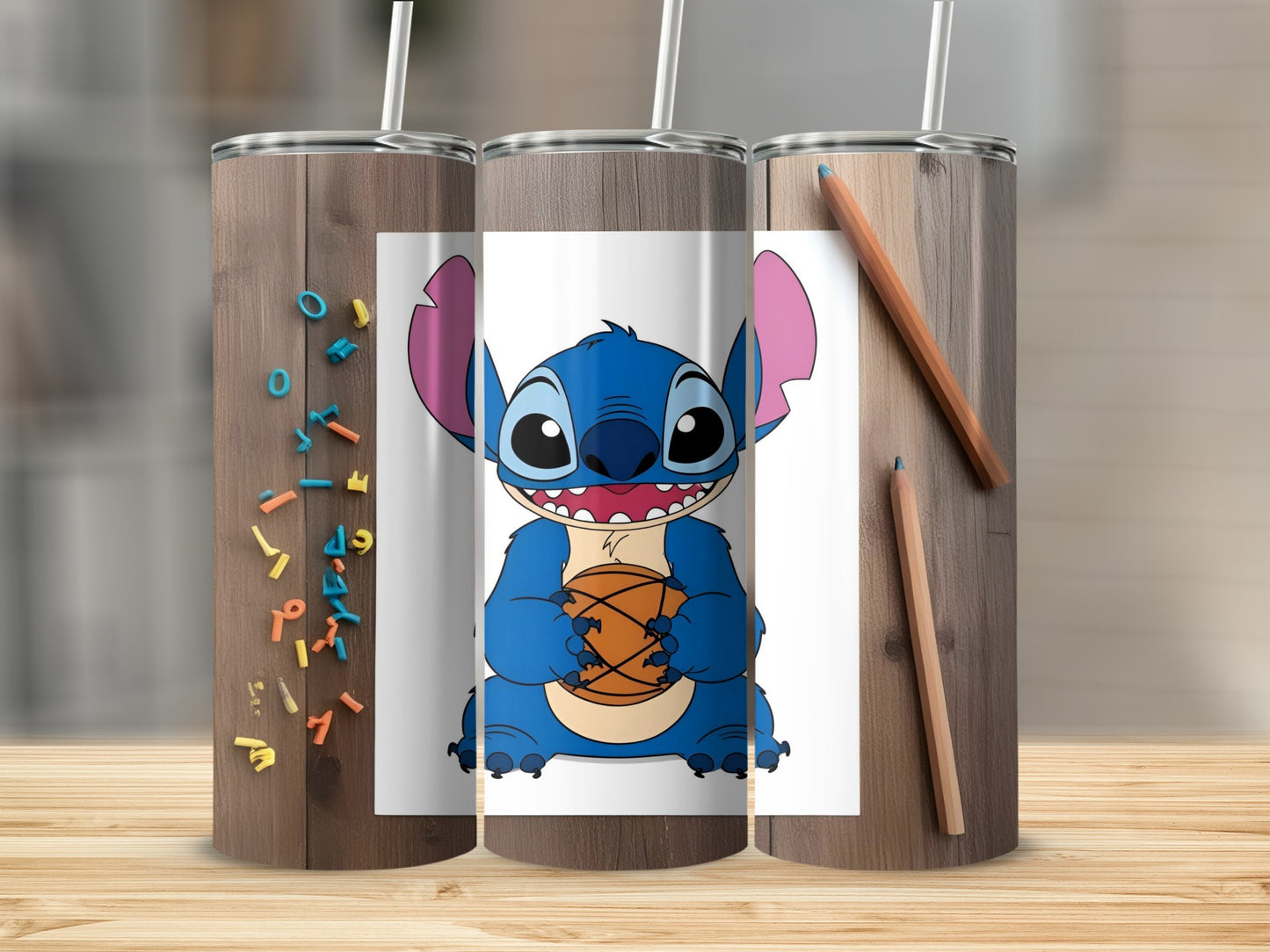 Stitch character holding a basketball, printed on three tumblers.