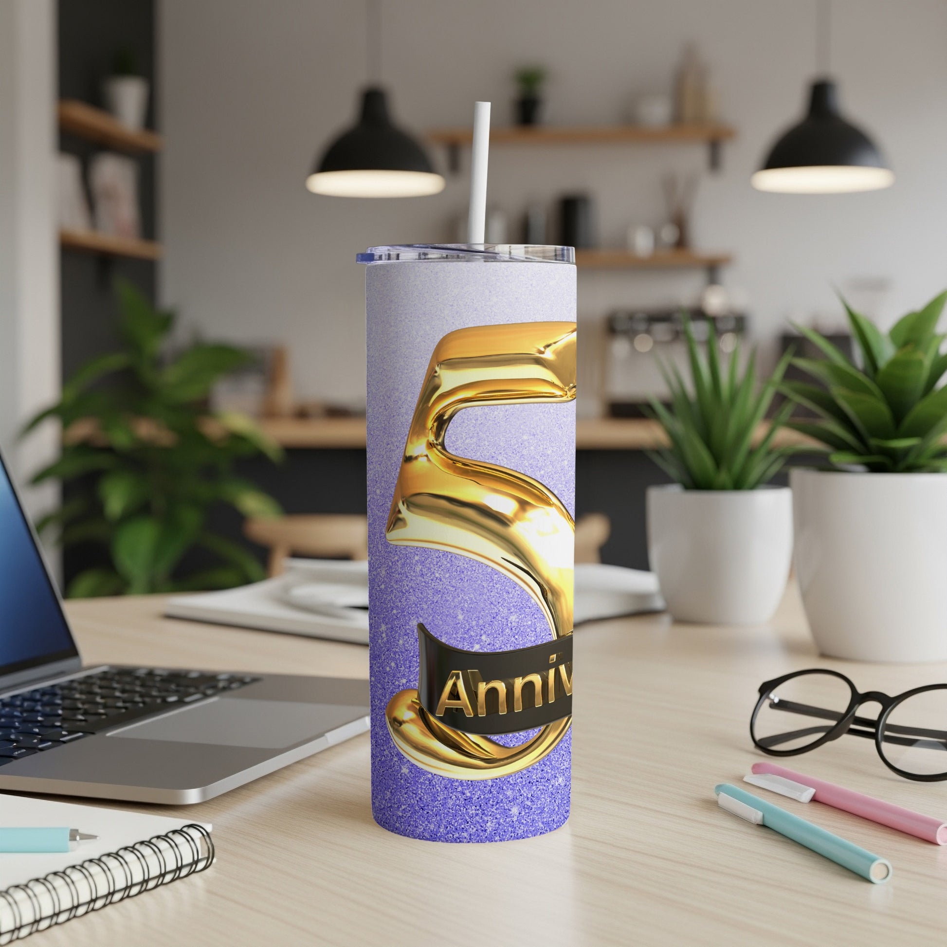 5th anniversary tumbler with purple glitter and gold numbers.