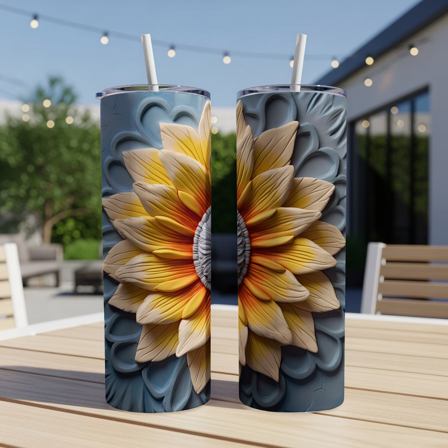 Two tumblers with a textured sunflower design sit on a wooden table.