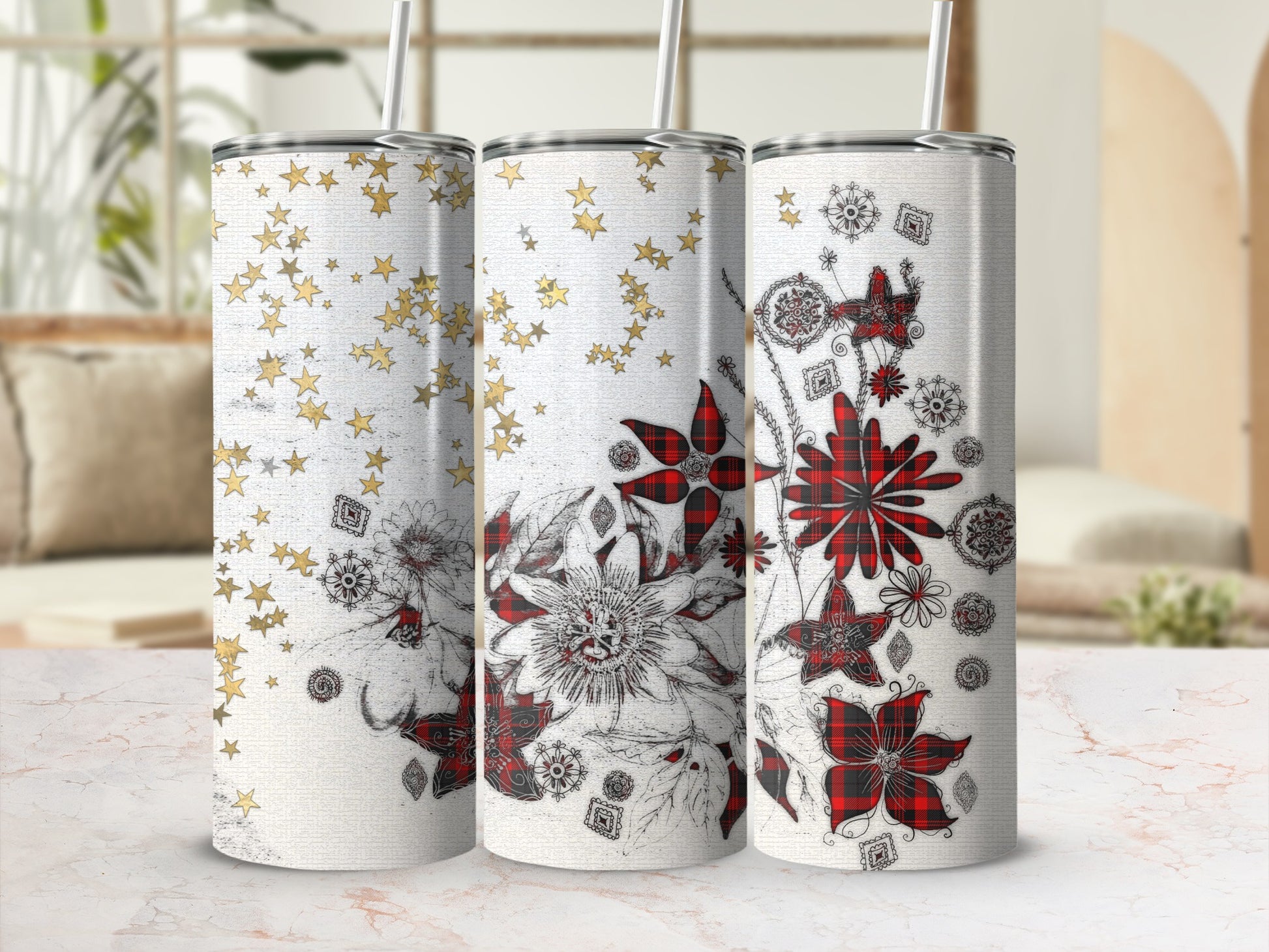 Three tumblers with floral and star patterns in red and gold.