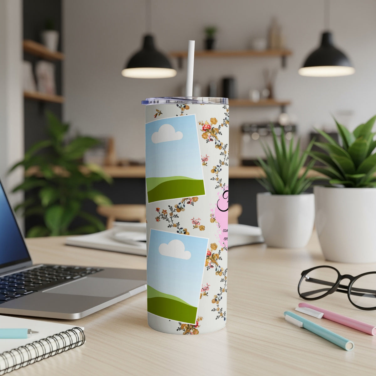 Tumbler with floral pattern and two photo placeholders, on a desk.
