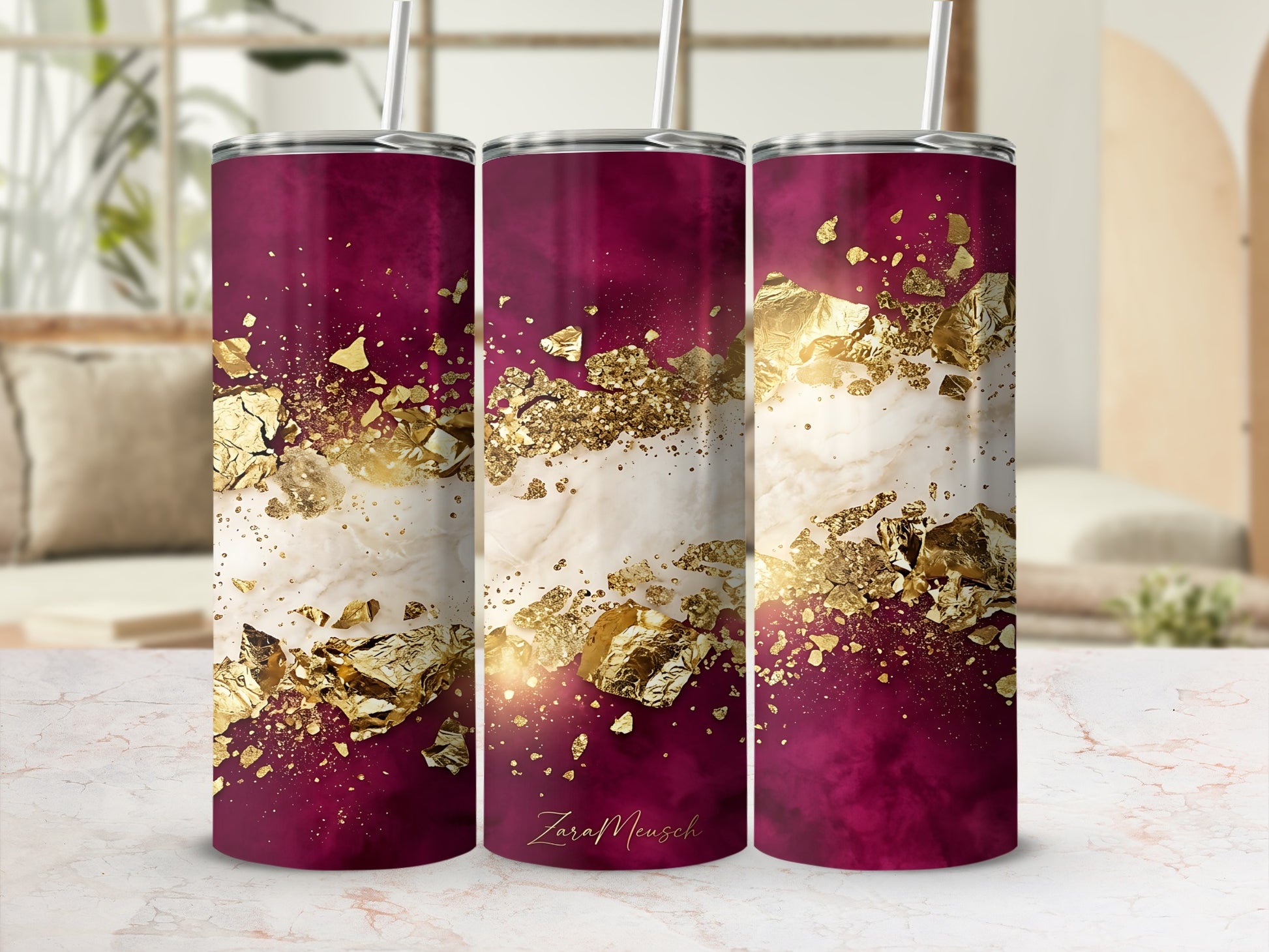 Maroon tumbler with white marble and gold foil accents.
