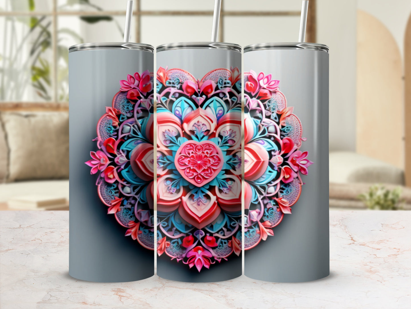 Three tumblers with a pink and blue floral mandala heart design.