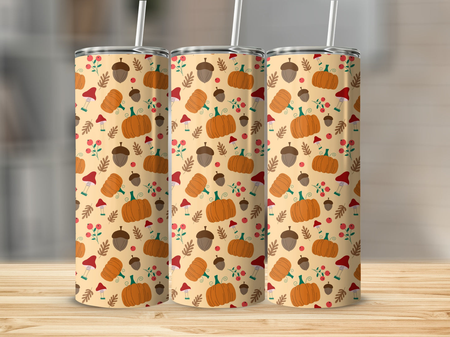 Three tumblers with a fall harvest pattern of pumpkins, acorns, and mushrooms.
