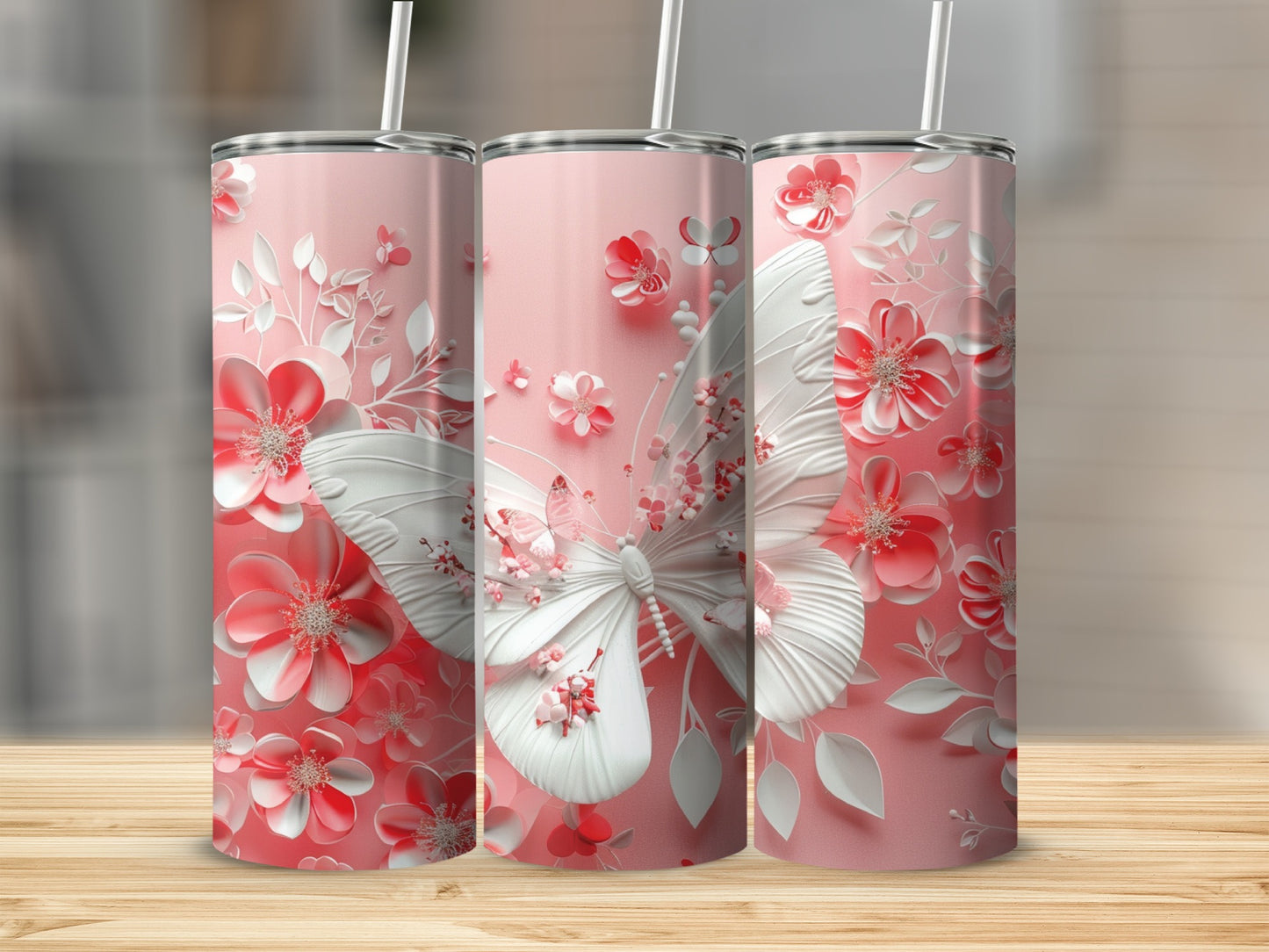 Pink tumbler with white embossed butterfly and floral design.
