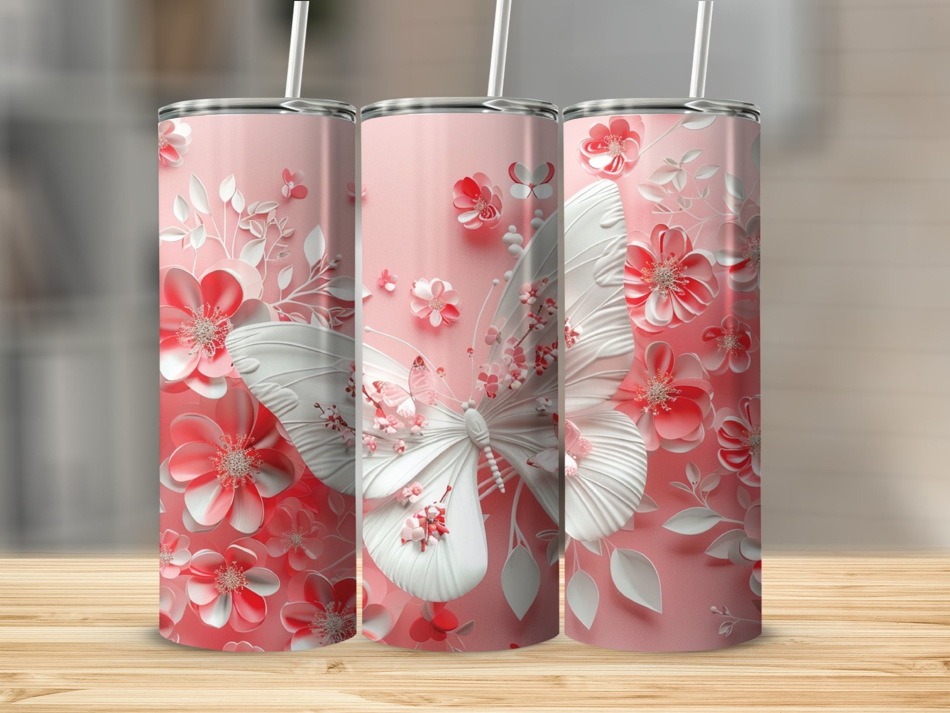 Pink tumbler with white embossed butterfly and floral design.