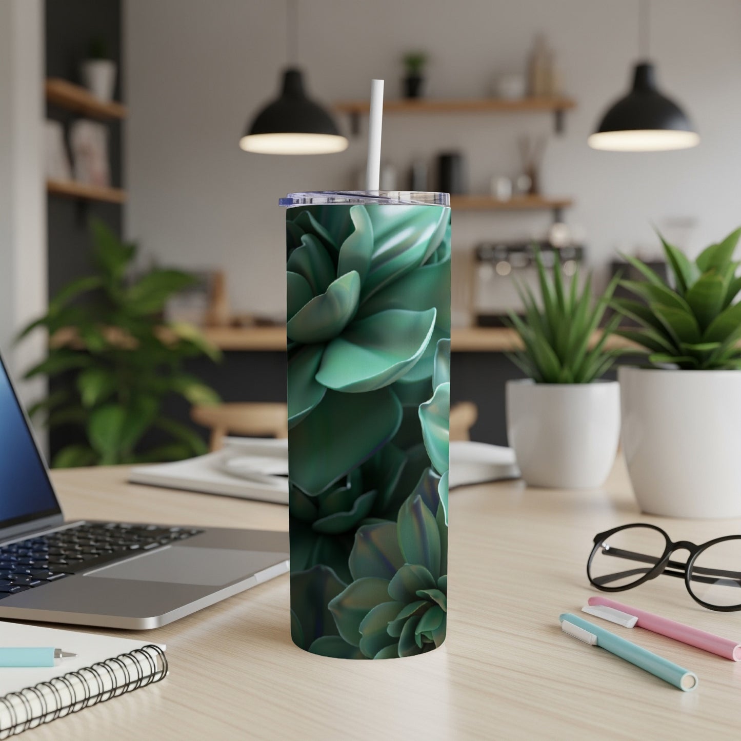 Green succulent pattern on a white tumbler with straw.
