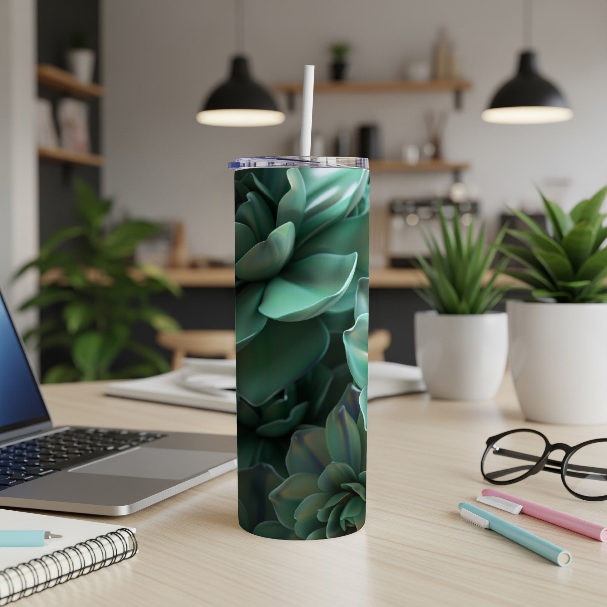 Green succulent pattern on a white tumbler with straw.