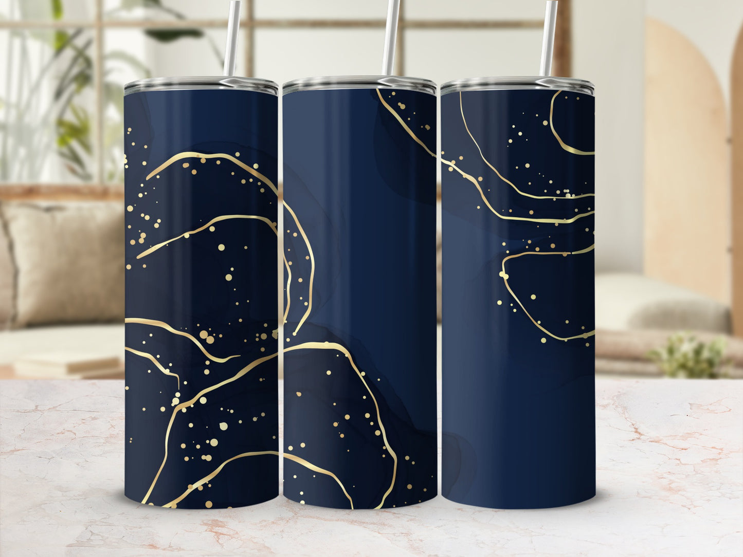 Three navy blue tumblers with gold abstract splatters and lines pattern.
