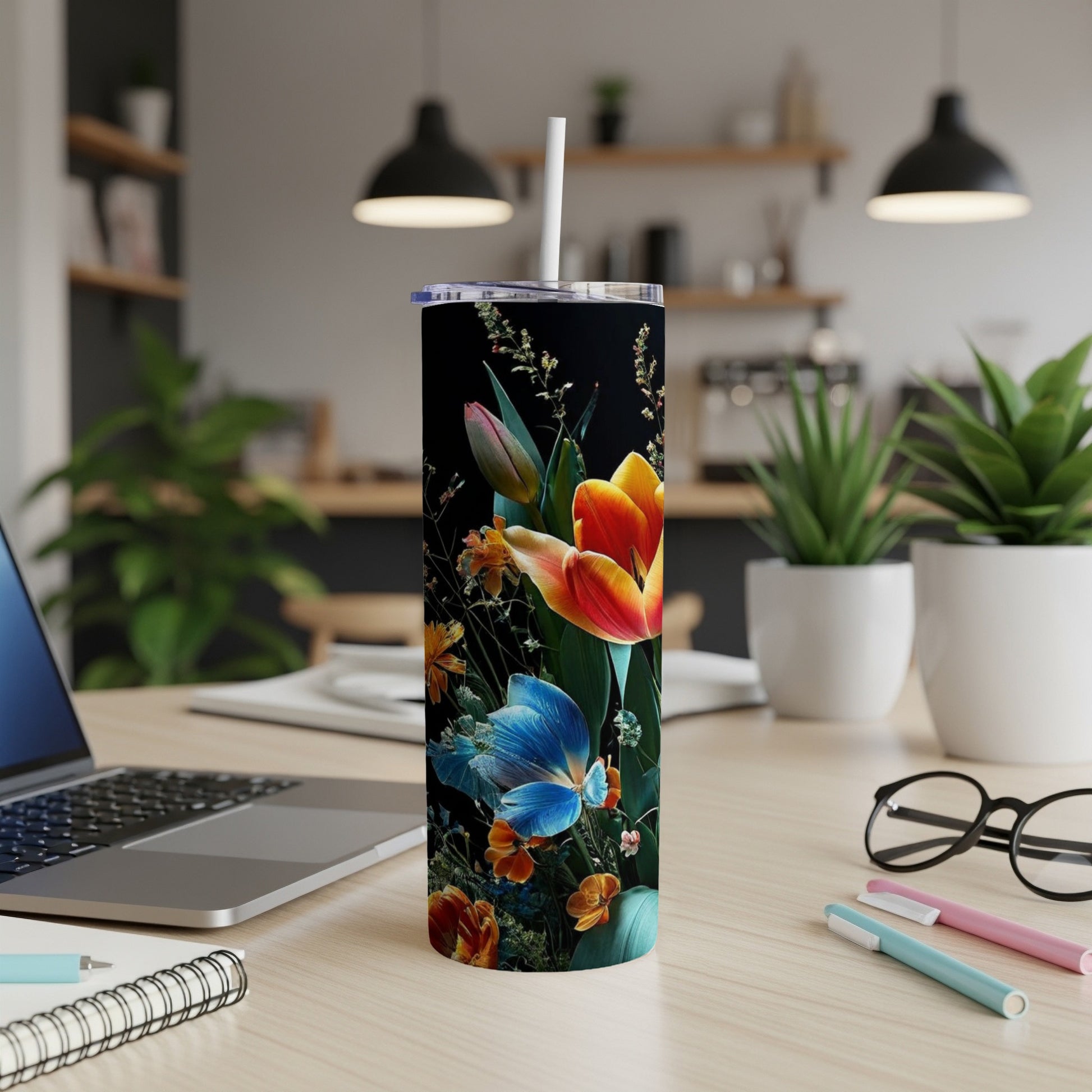 Tall black tumbler with vibrant floral pattern, featuring tulips and greenery.