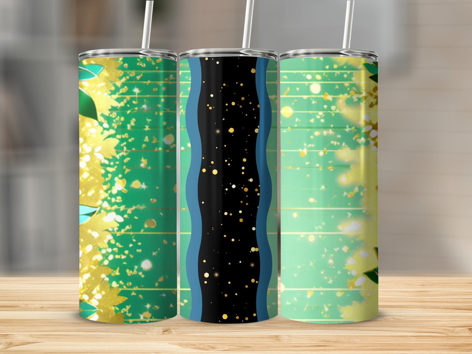 Three tumblers with green, gold, and abstract patterns.