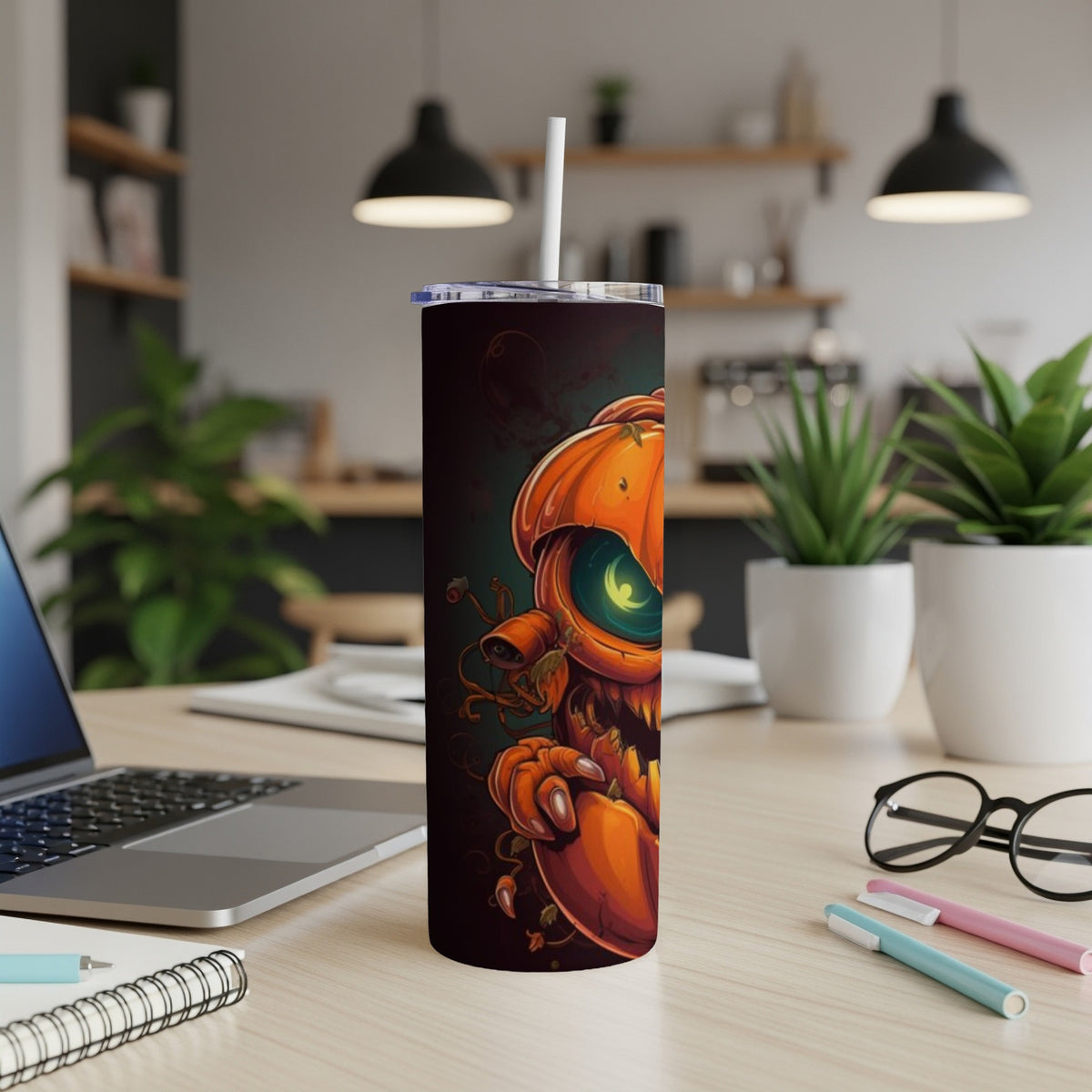 Tumbler with a spooky cartoon pumpkin illustration, featuring a bright green eye.