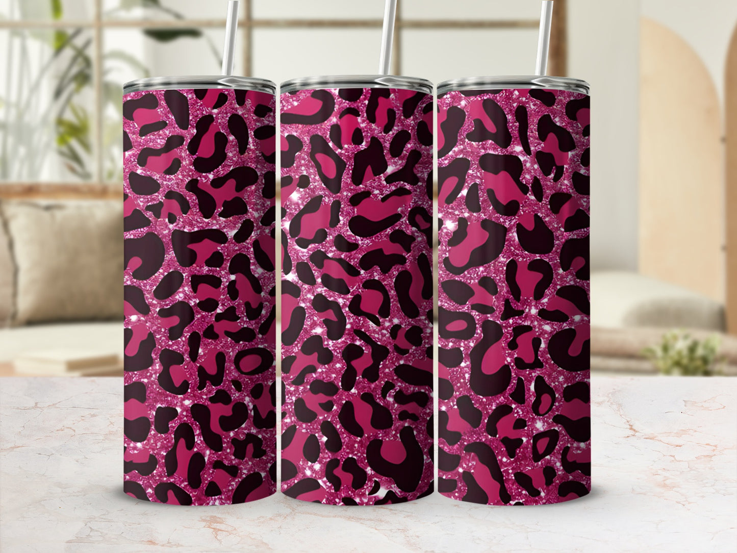 Three tall tumblers with pink and black leopard print glitter pattern.