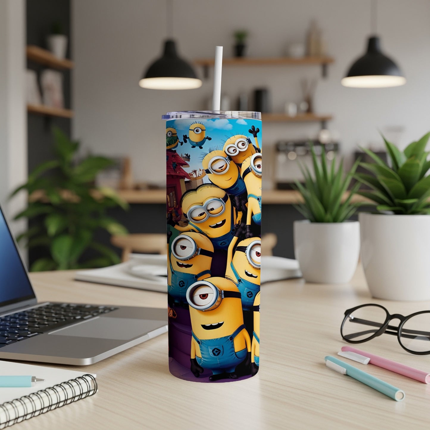 Minions characters on a purple and blue tumbler cup.