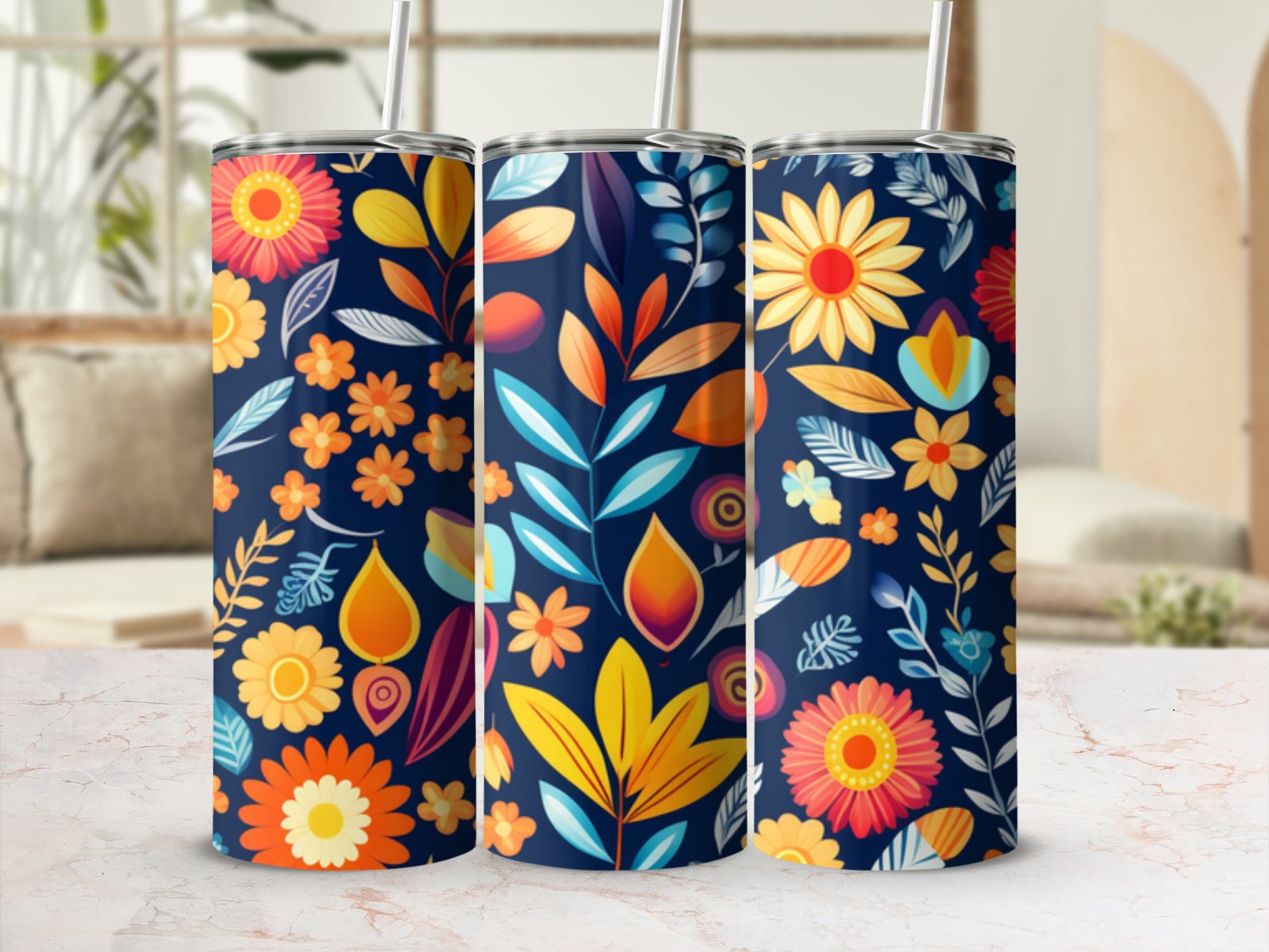 Three dark blue tumblers with a vibrant floral and leaf pattern.