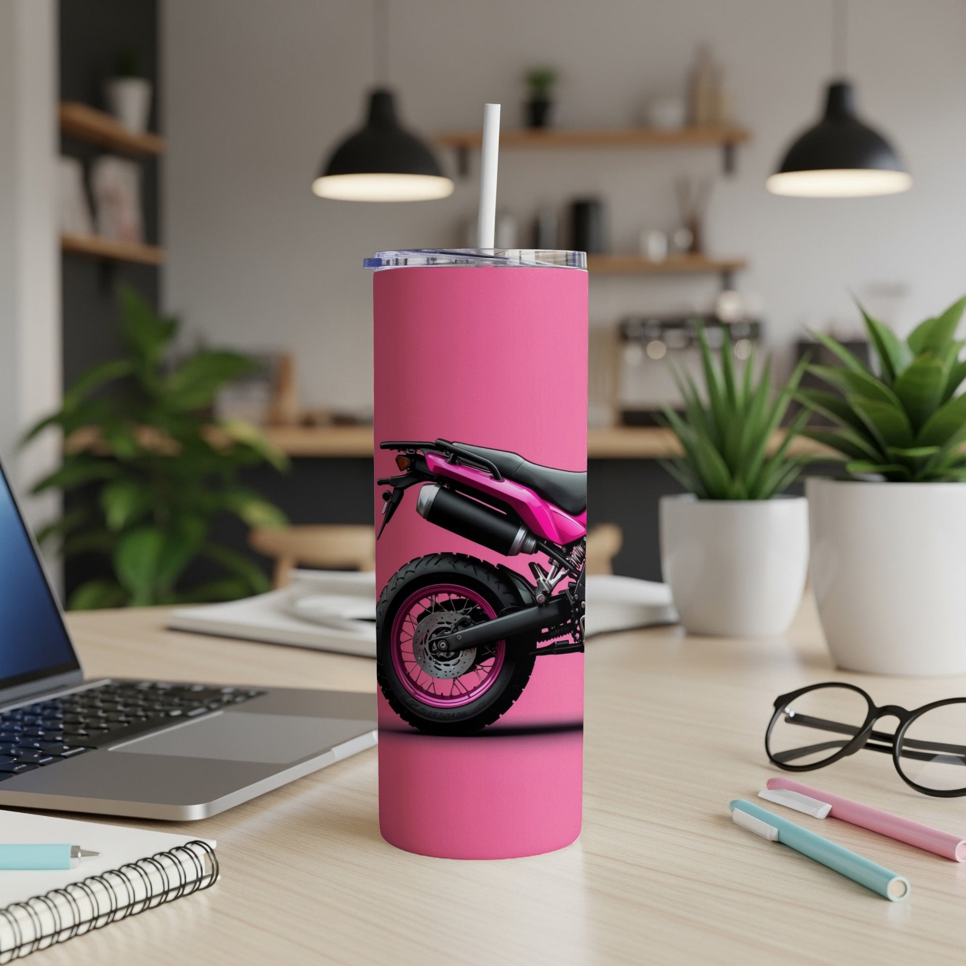 Pink tumbler with motorcycle tire and wheel design.
