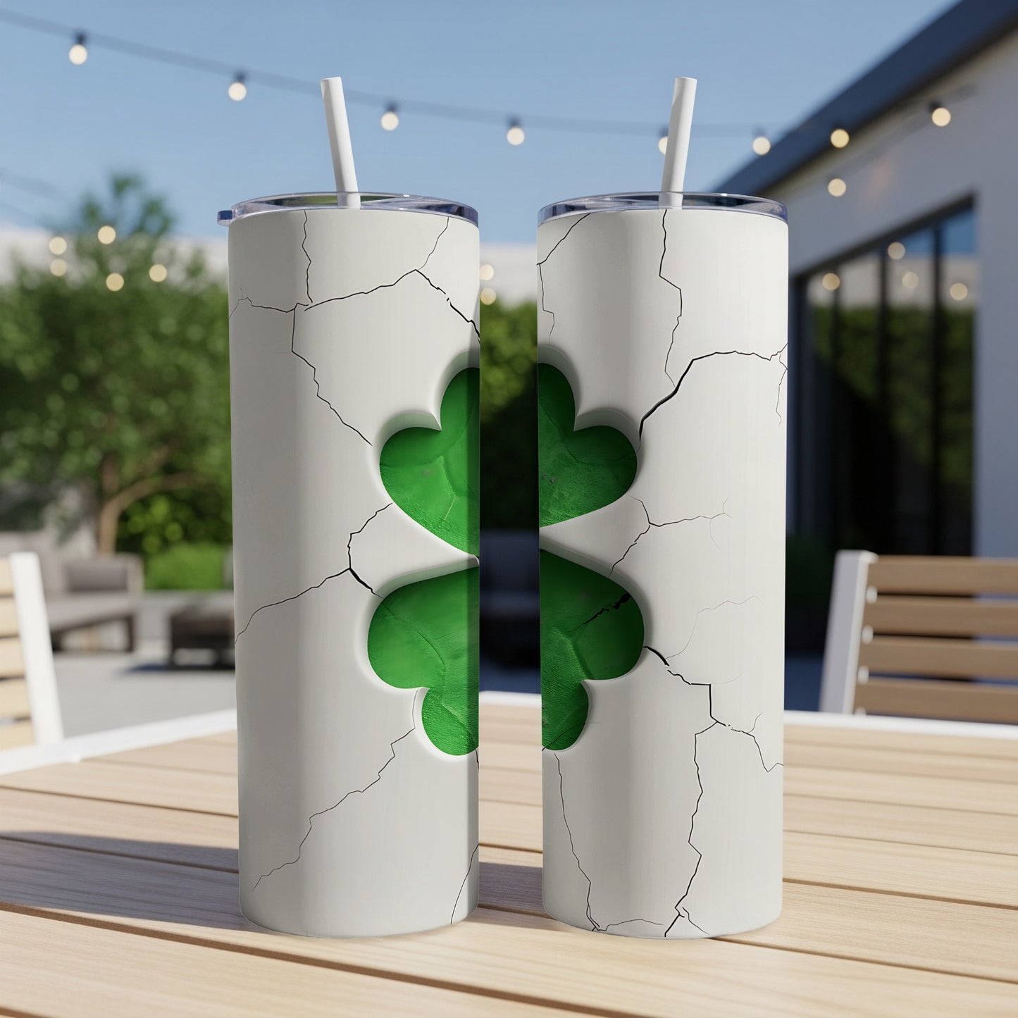 Two white tumblers with a cracked design revealing a green shamrock.