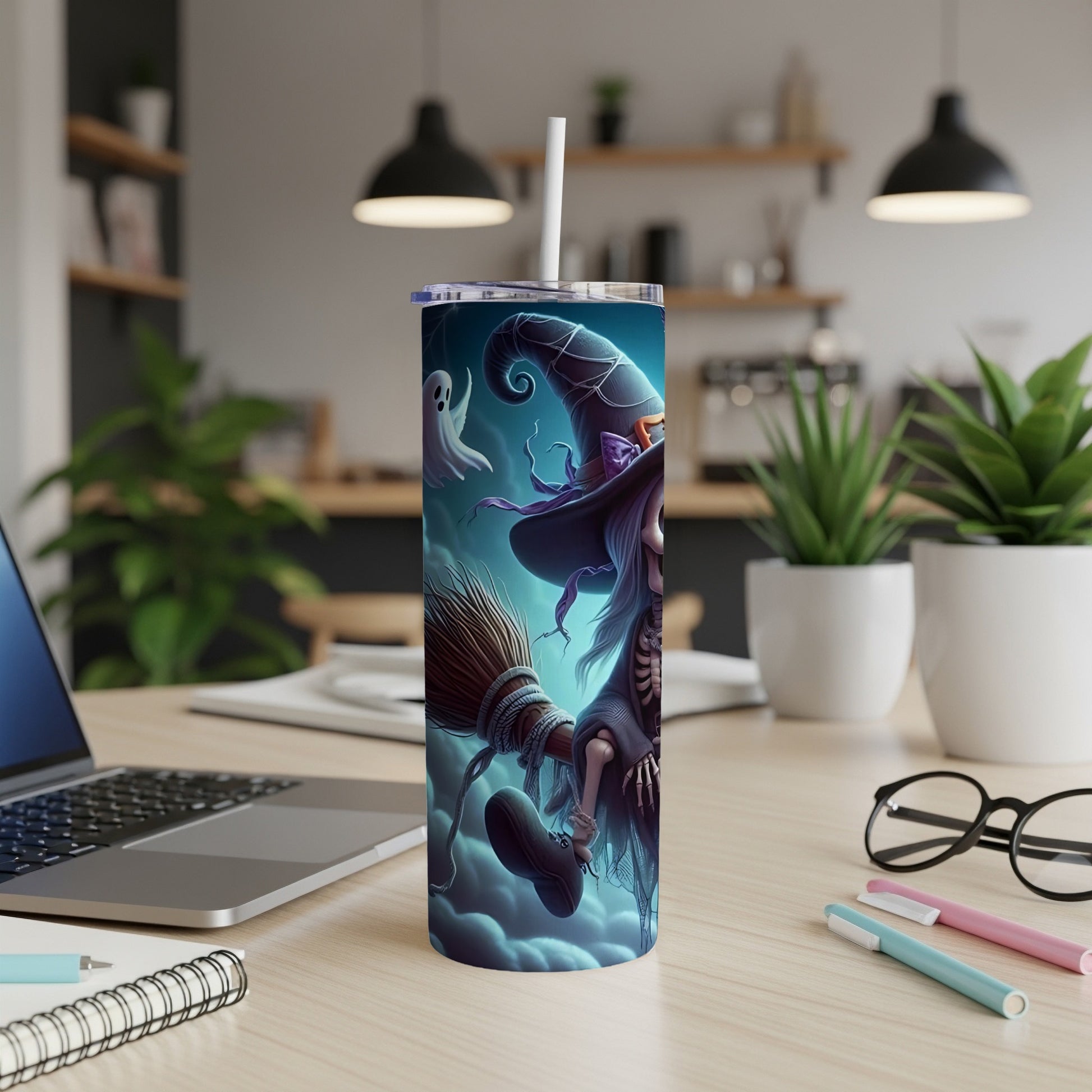 Tumbler with witch, broom, and ghost Halloween design.