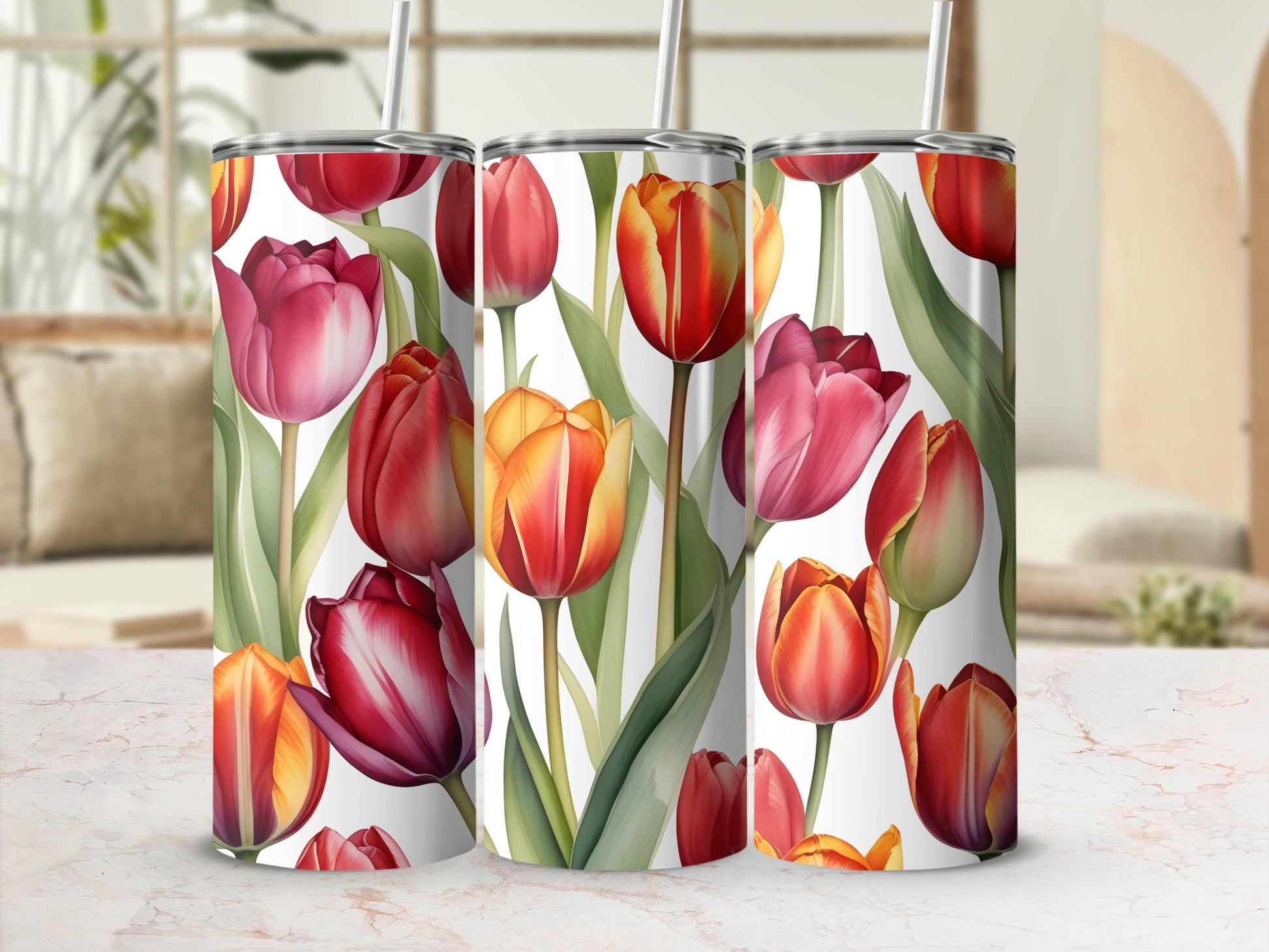 Tumblers with a watercolor floral design of red and orange tulips.