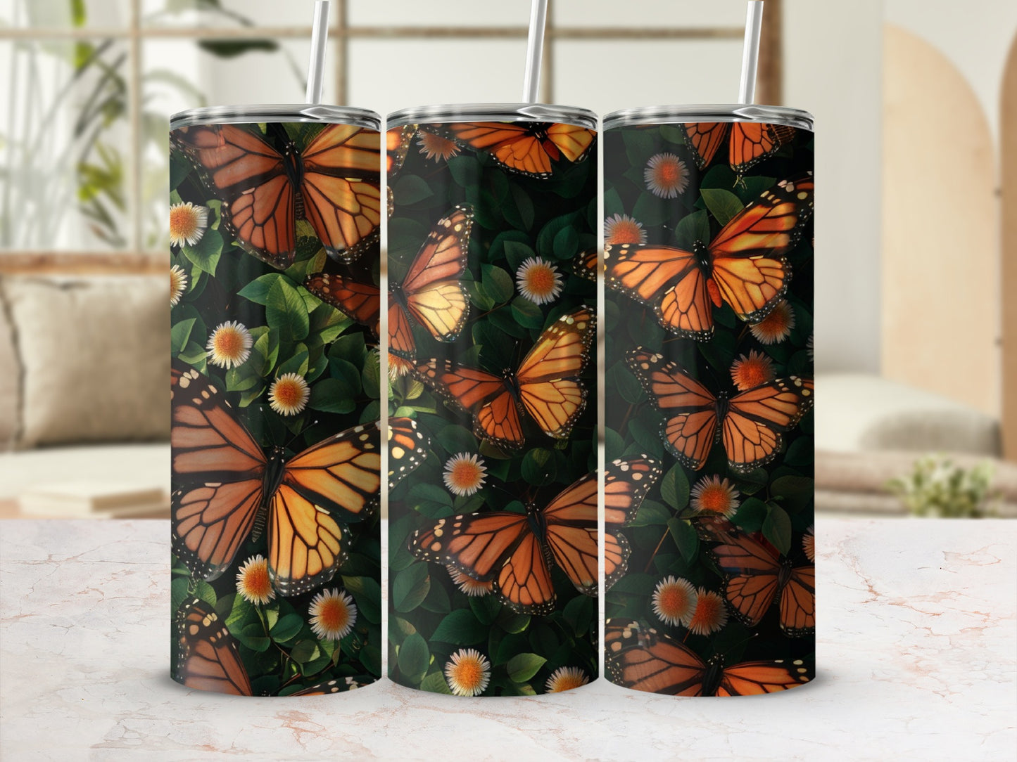 Monarch butterflies and white flowers on a patterned tumbler.