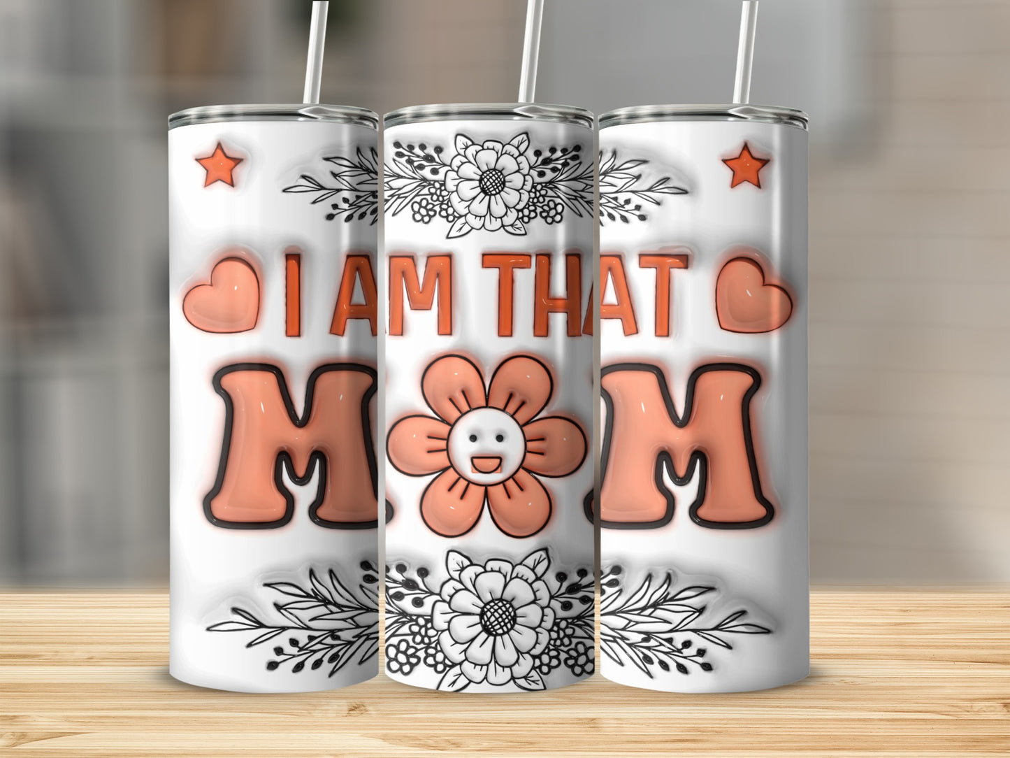 Tumbler with "I AM THAT MOM" text and floral design.
