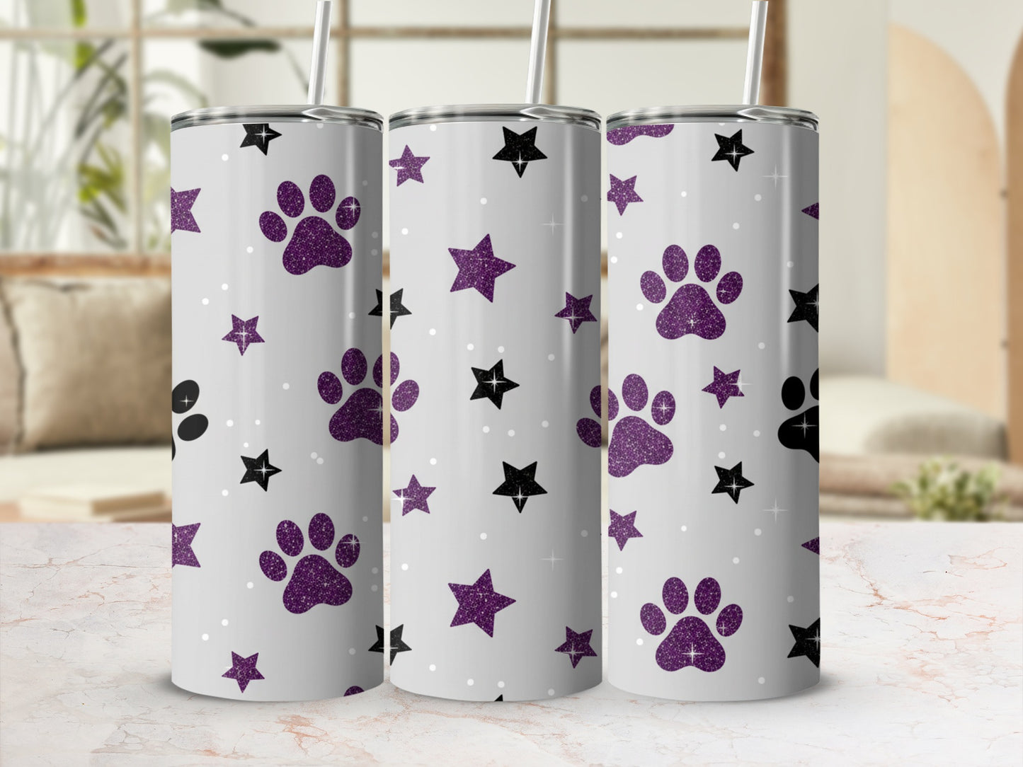 White tumbler with purple glitter paw prints and stars pattern.