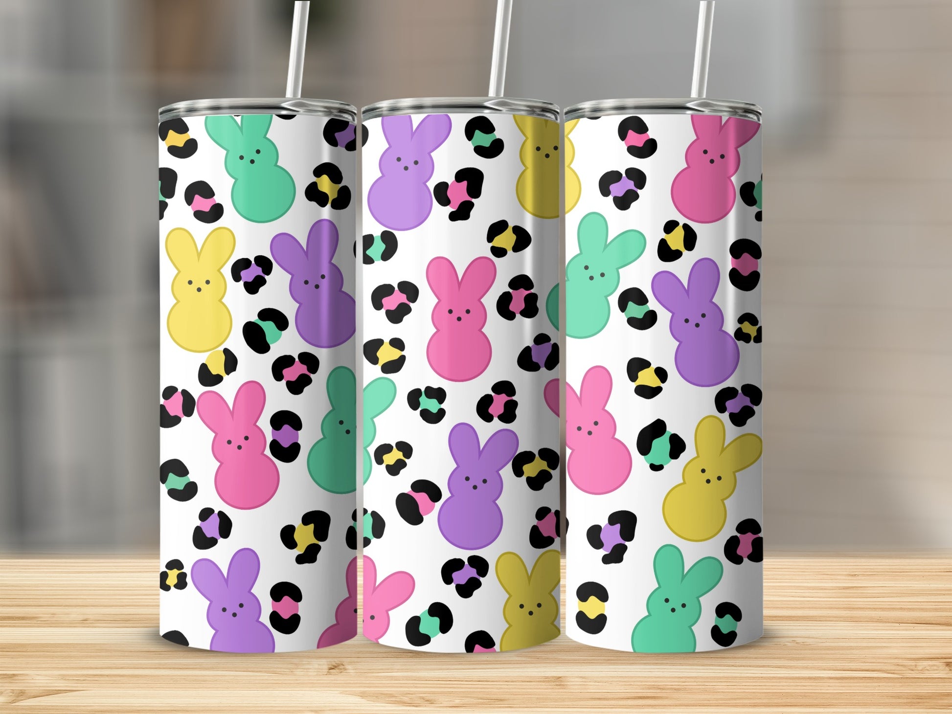 Three tumblers with a colorful Peeps bunny and leopard print pattern.