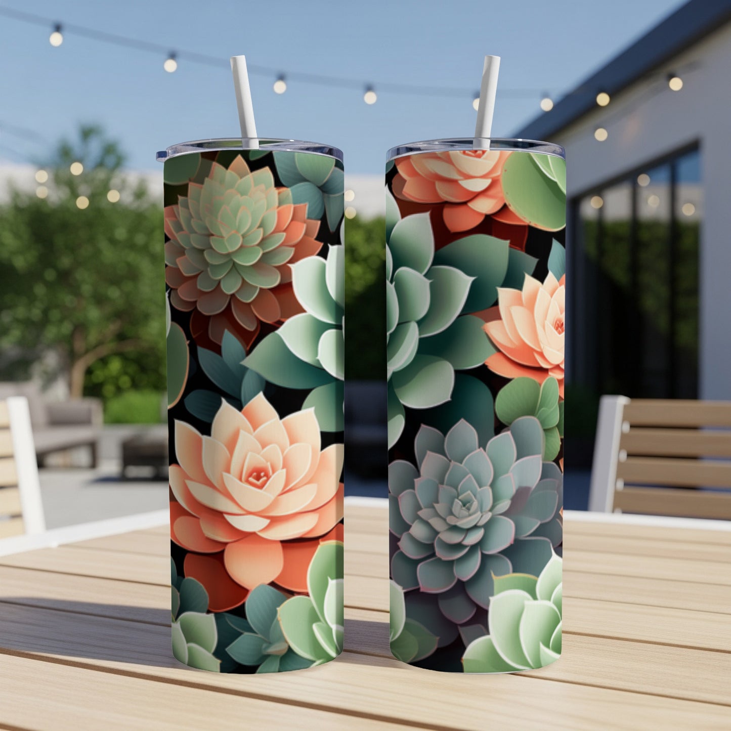 Two tumblers with a succulent floral pattern on a wooden table.