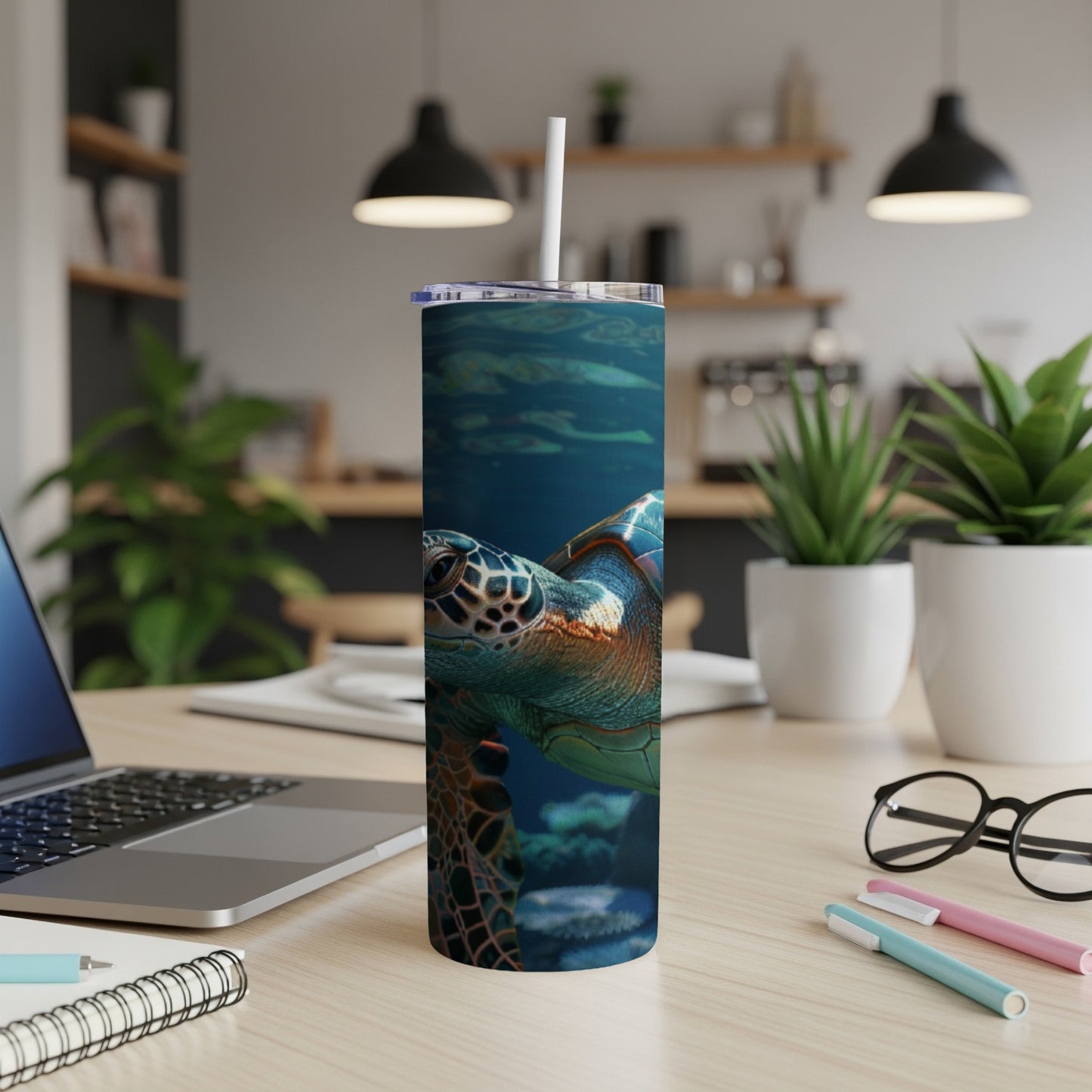 Sea turtle illustration on a white tumbler with a straw.