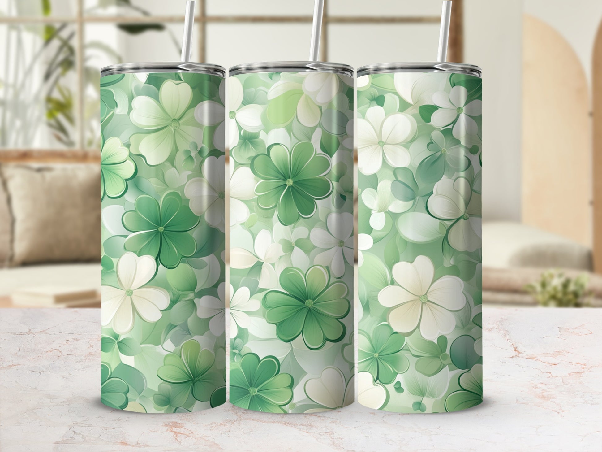 Three tumblers with a green and white floral pattern.