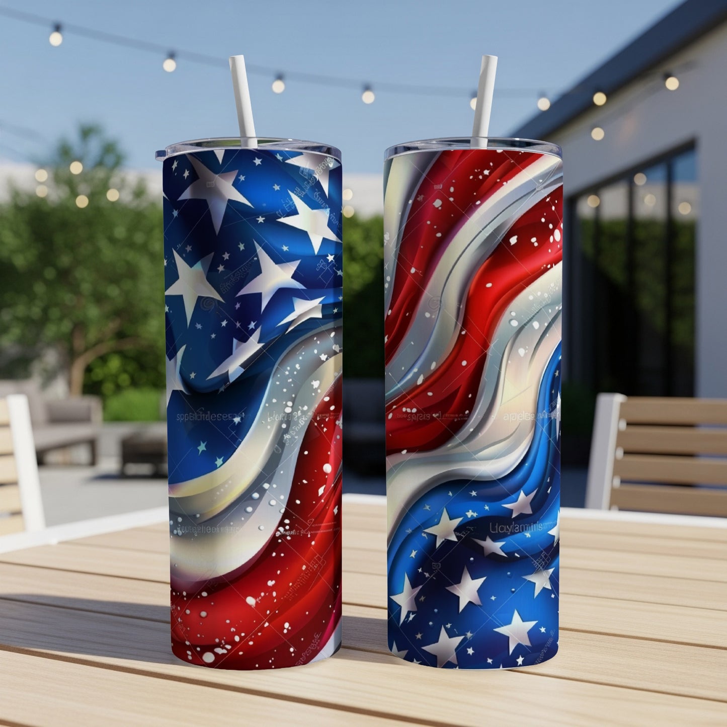 Two tumblers with American flag and star patterns on outdoor table.