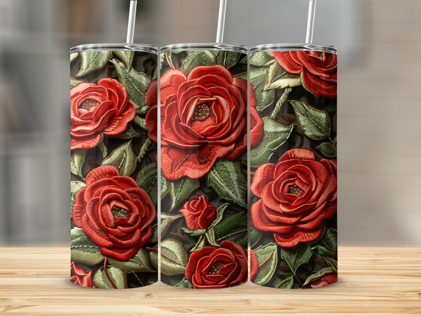 Three tumblers with a red rose and green leaf pattern.