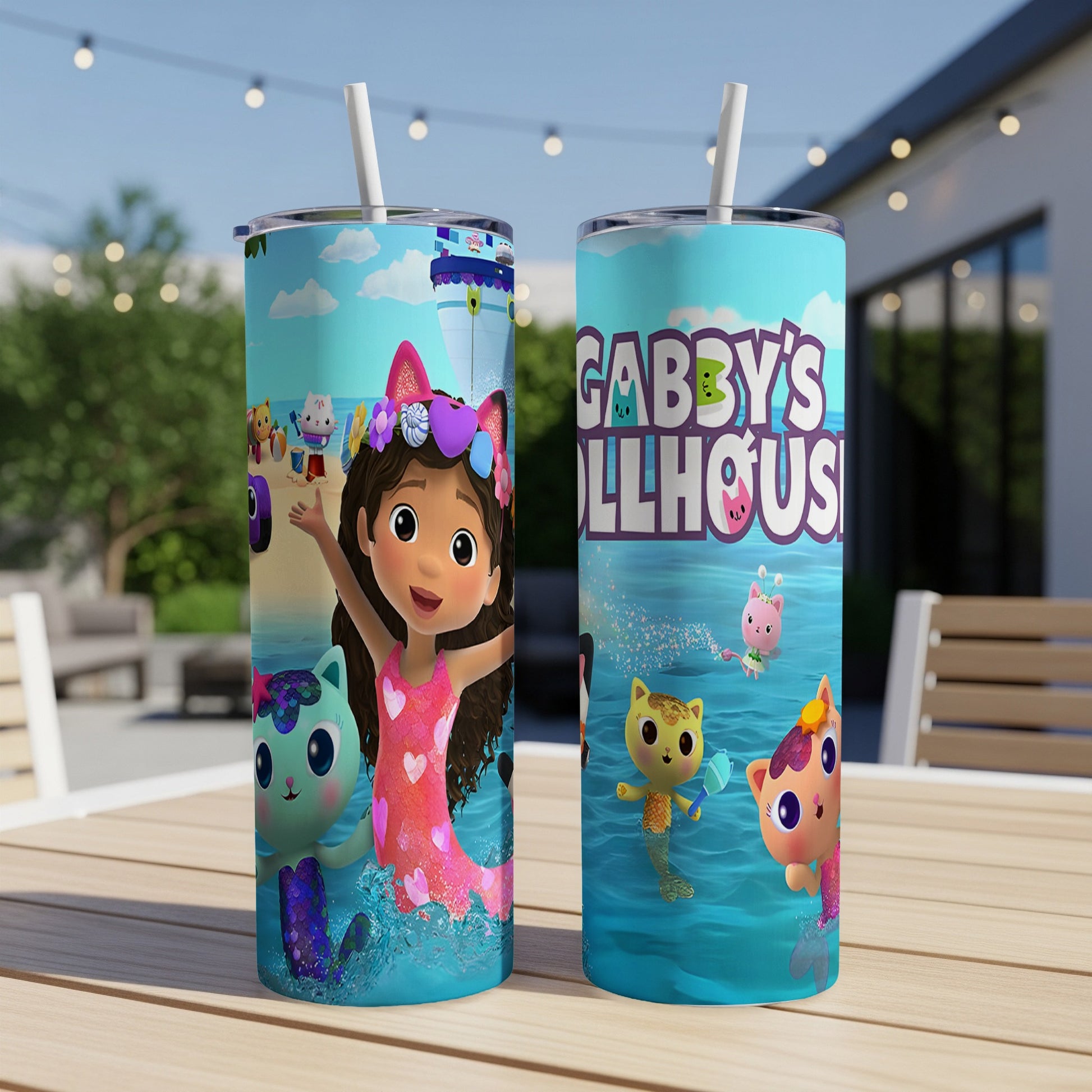 Gabby's Dollhouse characters on blue skinny tumblers with straws.