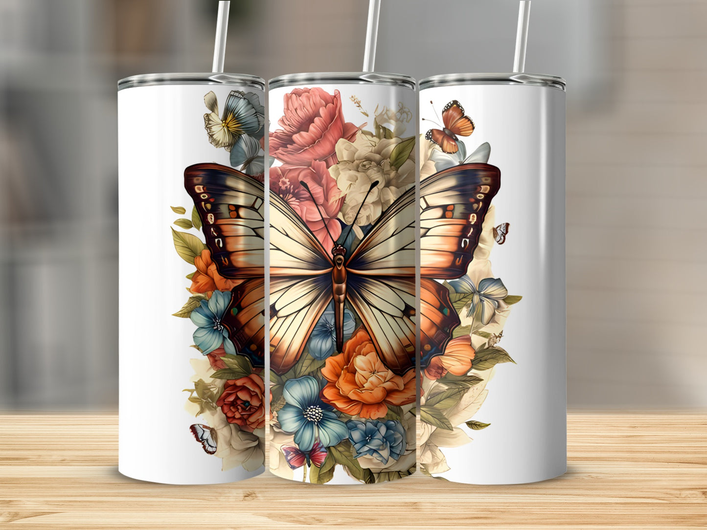 Three tumblers with a butterfly and floral design.