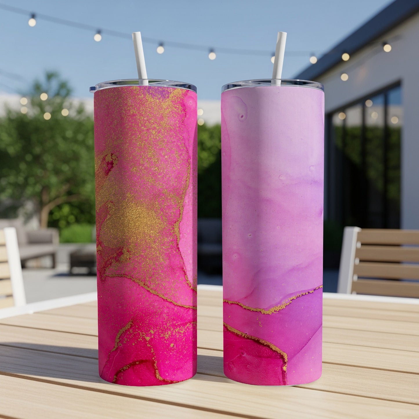 Two tumblers with pink and purple abstract watercolor designs and gold accents.