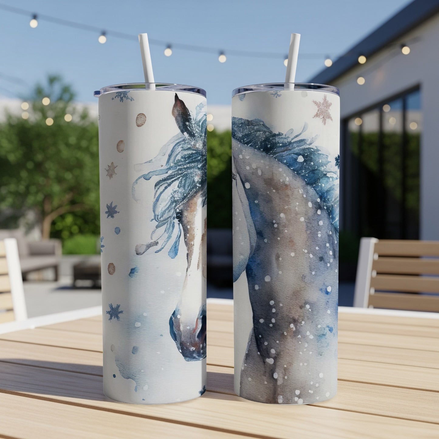 Two tumblers with watercolor horse and snowflake designs.