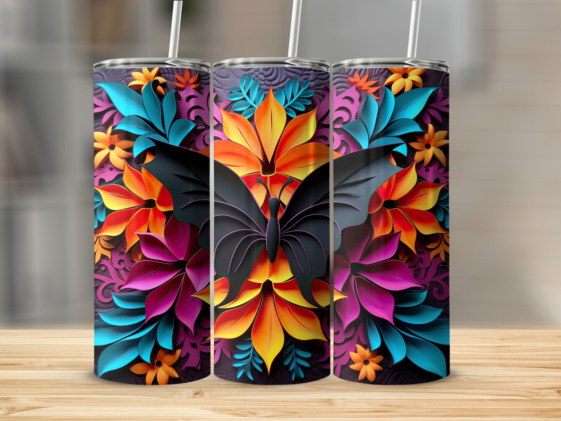 Three tumblers with black butterfly and vibrant floral papercut design.