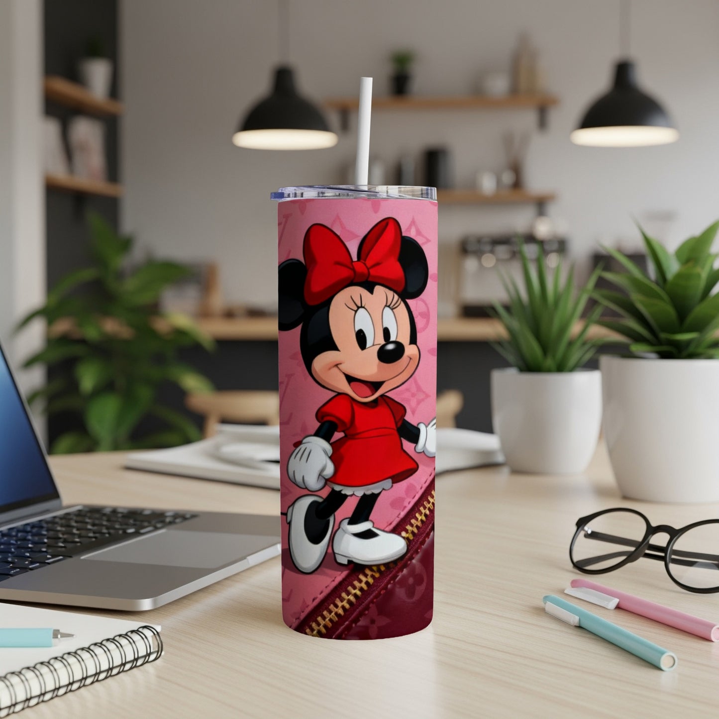 Minnie Mouse on pink tumbler with zipper detail and bow.