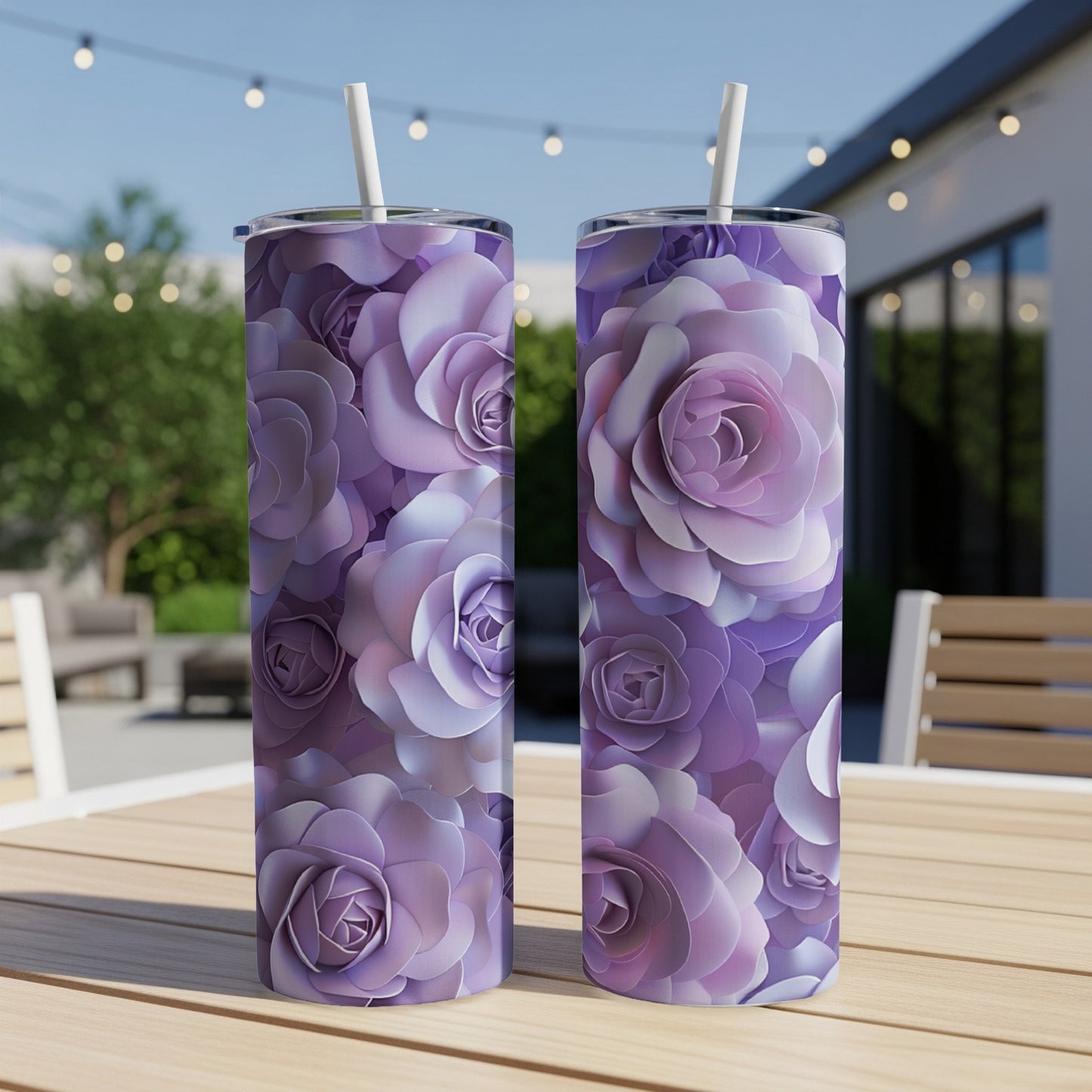 Two tall tumblers with a purple floral rose pattern on a wooden table.