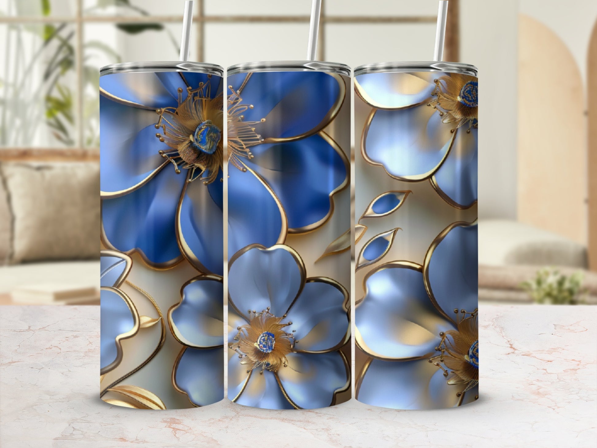 Three tall tumblers with blue floral designs and gold accents.