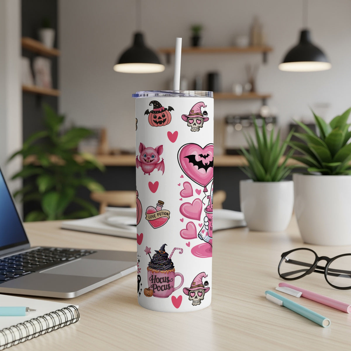 White tumbler with Halloween-themed pink and black cartoon icons and text.