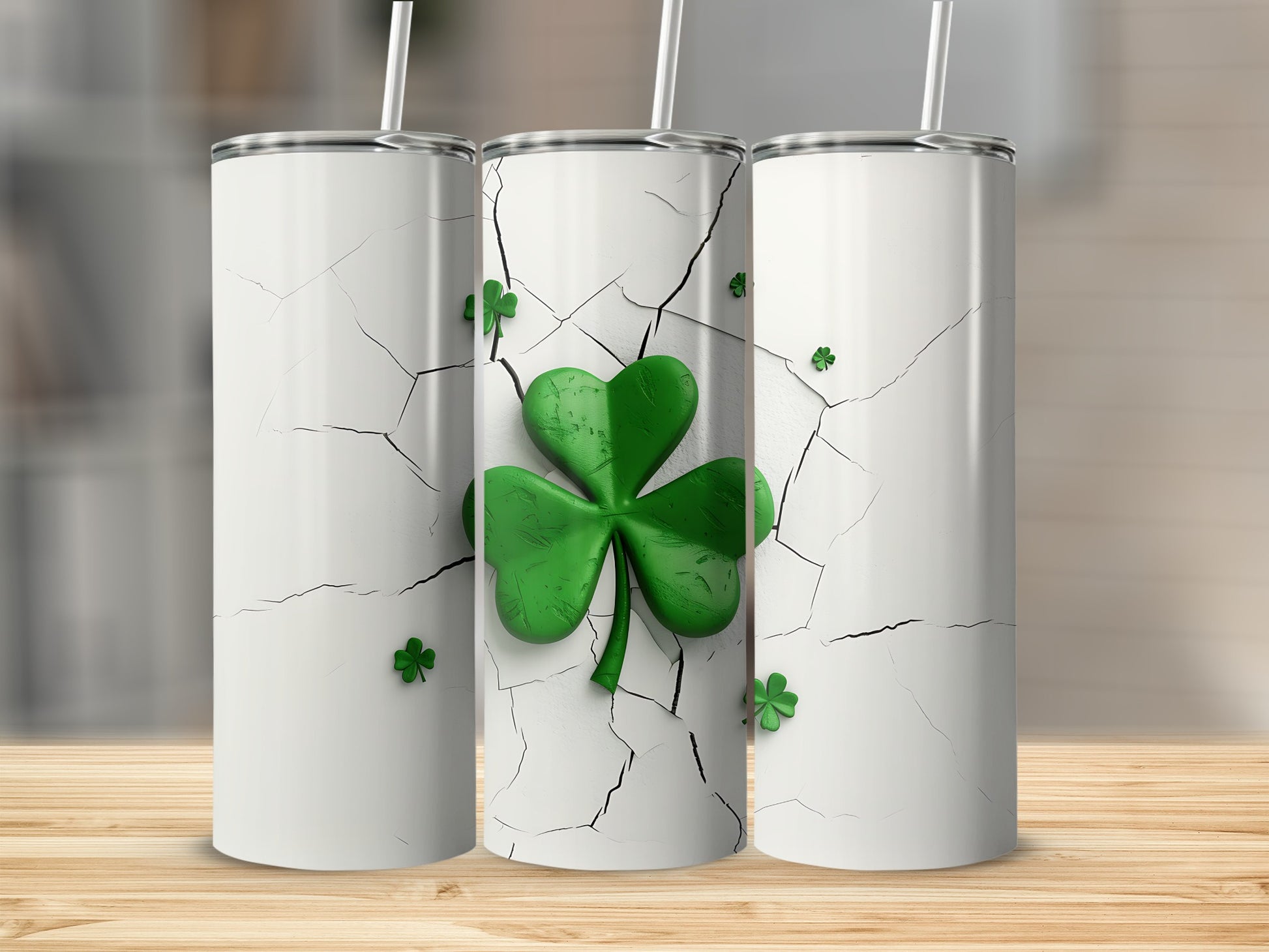 Three white tumblers with cracked texture and green shamrock designs.